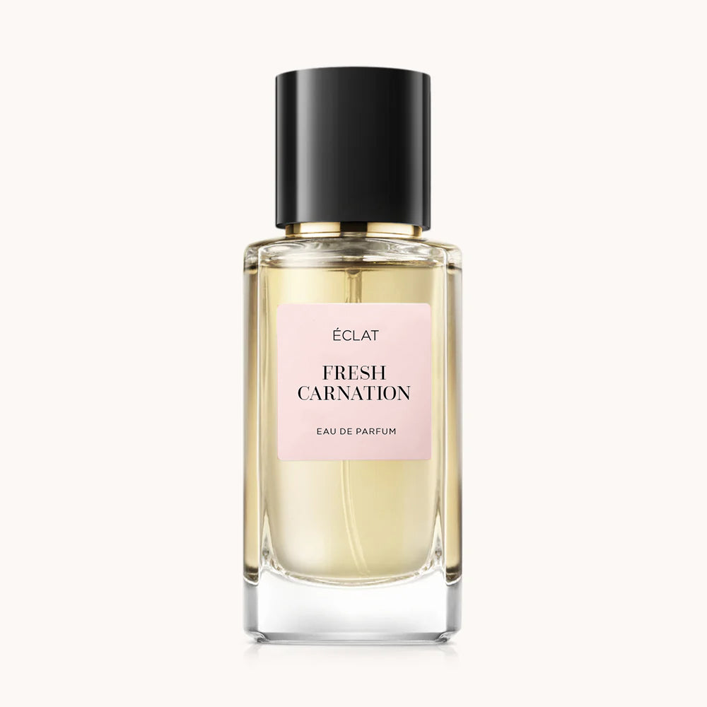 Flacon of the women’s perfume dupe ÉCLAT Fresh Carnation, an elegant transparent glass bottle with a black cylindrical magnetic cap and a light pink label. The label displays the brand name ÉCLAT, the name Fresh Carnation, and the phrase “Eau de Parfum”.