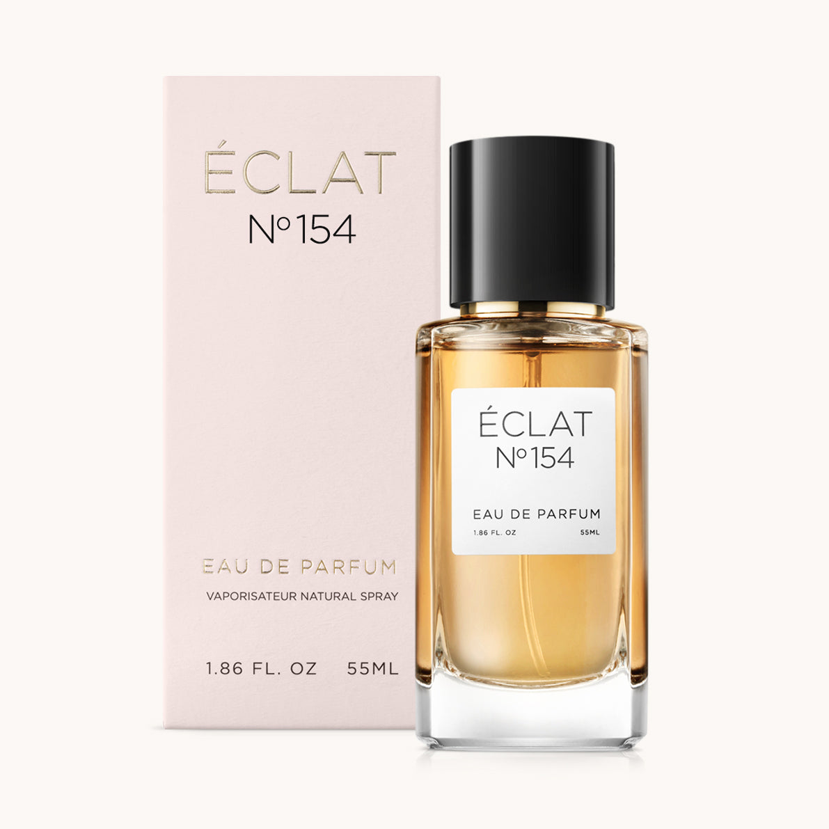 ÉCLAT No. 154 perfume bottle with matching light pink packaging. The elegant glass flacon features a black cylindrical magnetic cap and a simple white label with the inscription ÉCLAT No. 154 and “Eau de Parfum”.