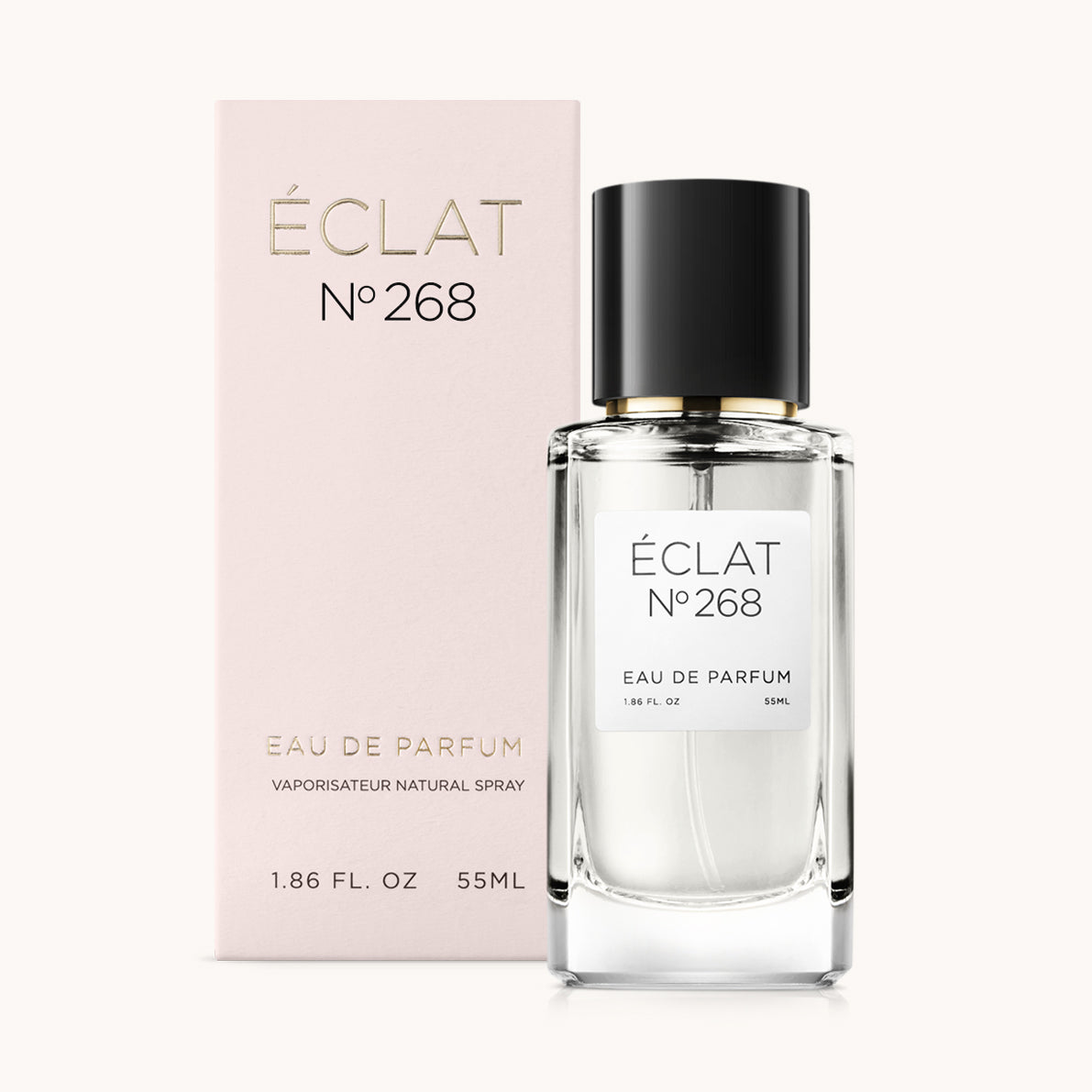 ÉCLAT No. 268 perfume bottle with matching light pink packaging. The elegant glass flacon features a black cylindrical magnetic cap and a simple white label with the inscription ÉCLAT No. 268 and “Eau de Parfum”.