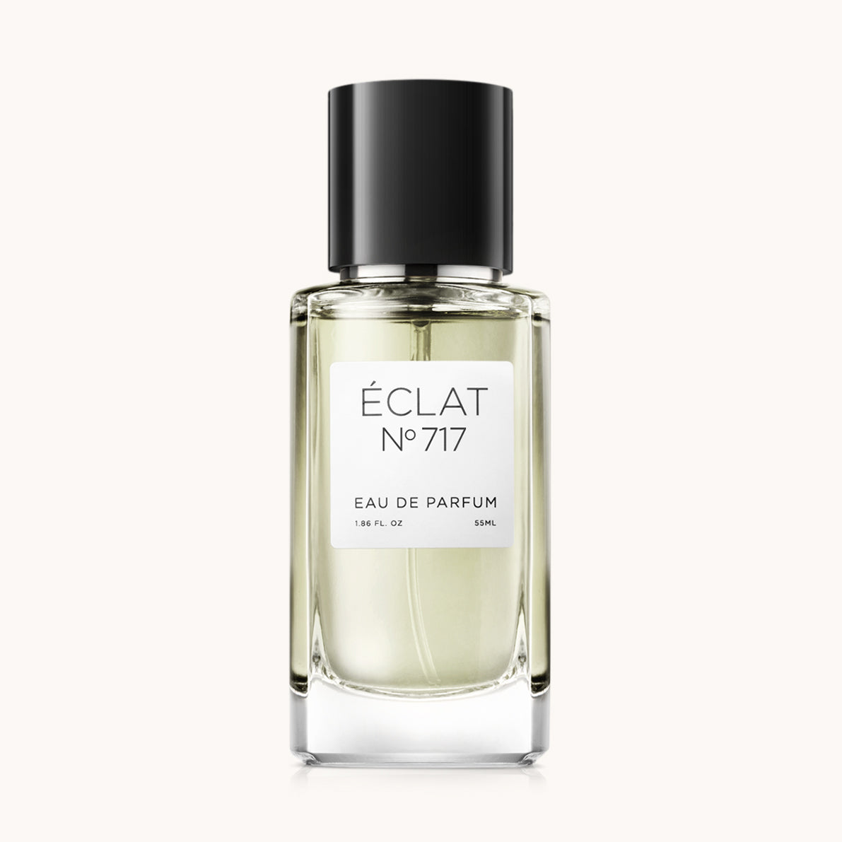 ÉCLAT No. 717 men’s perfume bottle with matching black packaging. The elegant flacon features a black cylindrical magnetic cap and a clean white label with the inscription ÉCLAT No. 717 and “Eau de Parfum”.