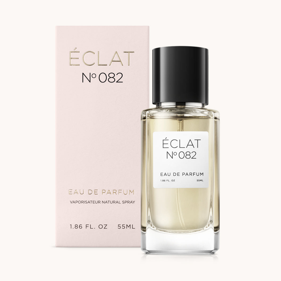 ÉCLAT No. 082 perfume bottle with matching light pink packaging. The elegant glass flacon features a black cylindrical magnetic cap and a simple white label with the inscription ÉCLAT No. 082 and “Eau de Parfum”.