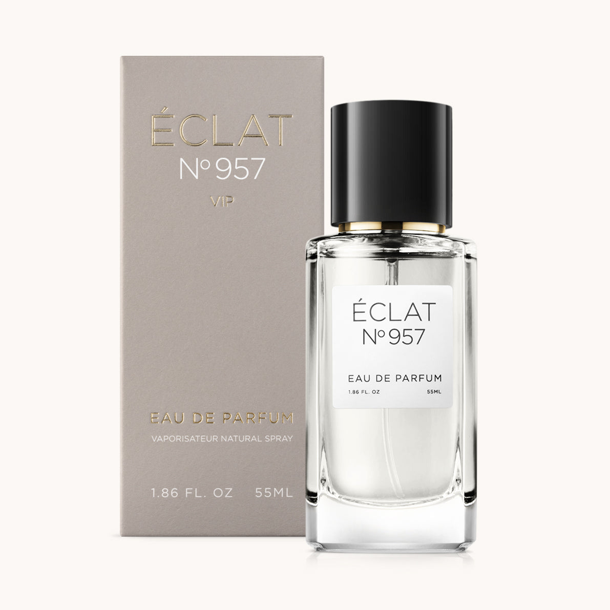 ÉCLAT No. 957 VIP unisex perfume bottle with matching taupe beige packaging. The elegant flacon features a black cylindrical magnetic cap and a clean white label with the inscription ÉCLAT No. 957 VIP and “Eau de Parfum”.