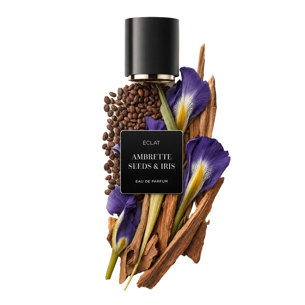 Ett arrangemang av ambrettafrön, irisblommor och träelement med en svart kåpa märkt 'ÉCLAT Ambrette Seeds & Iris.'