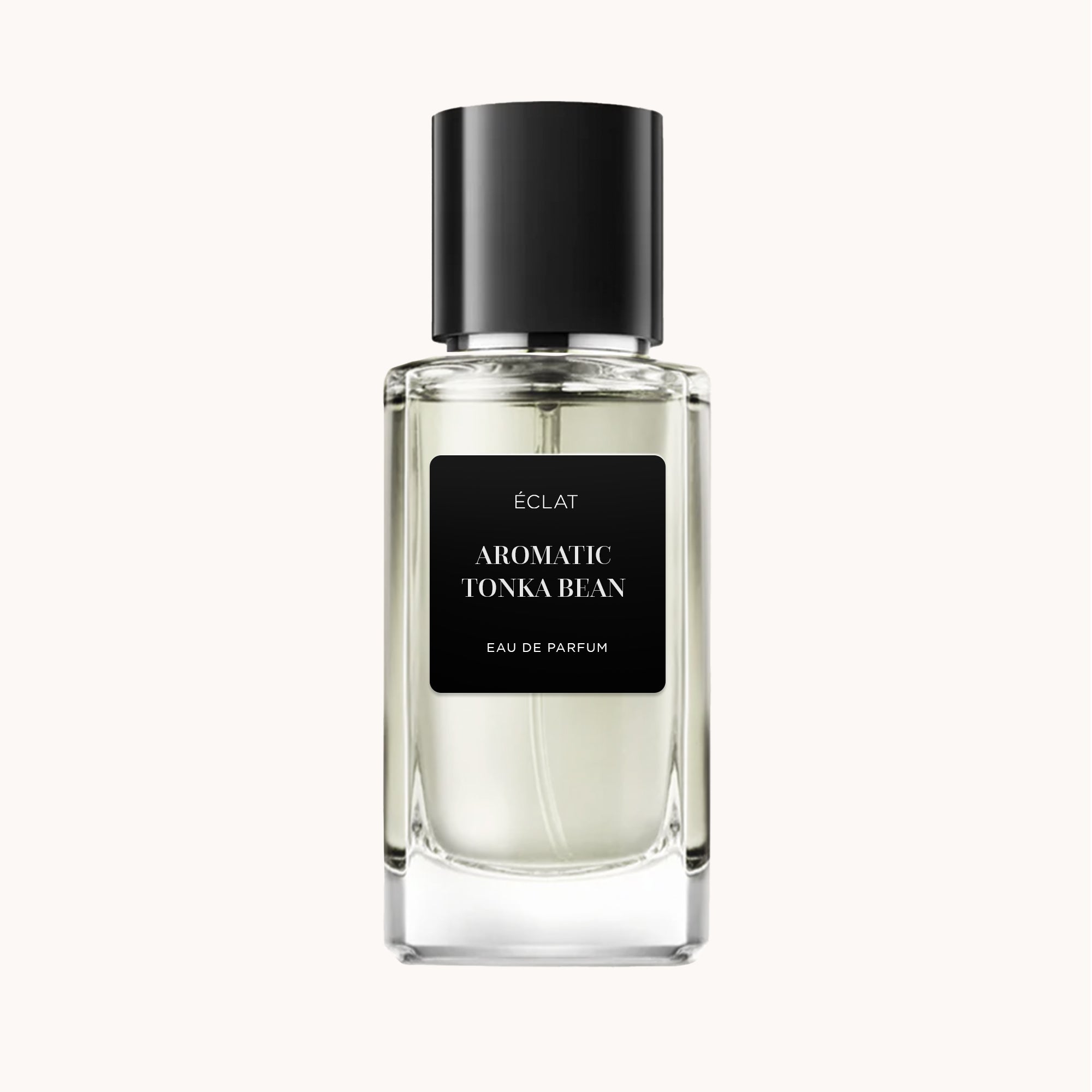 ÉCLAT Aromatic Tonka Bean in a clear faceted glass bottle with a black matte cap and label.