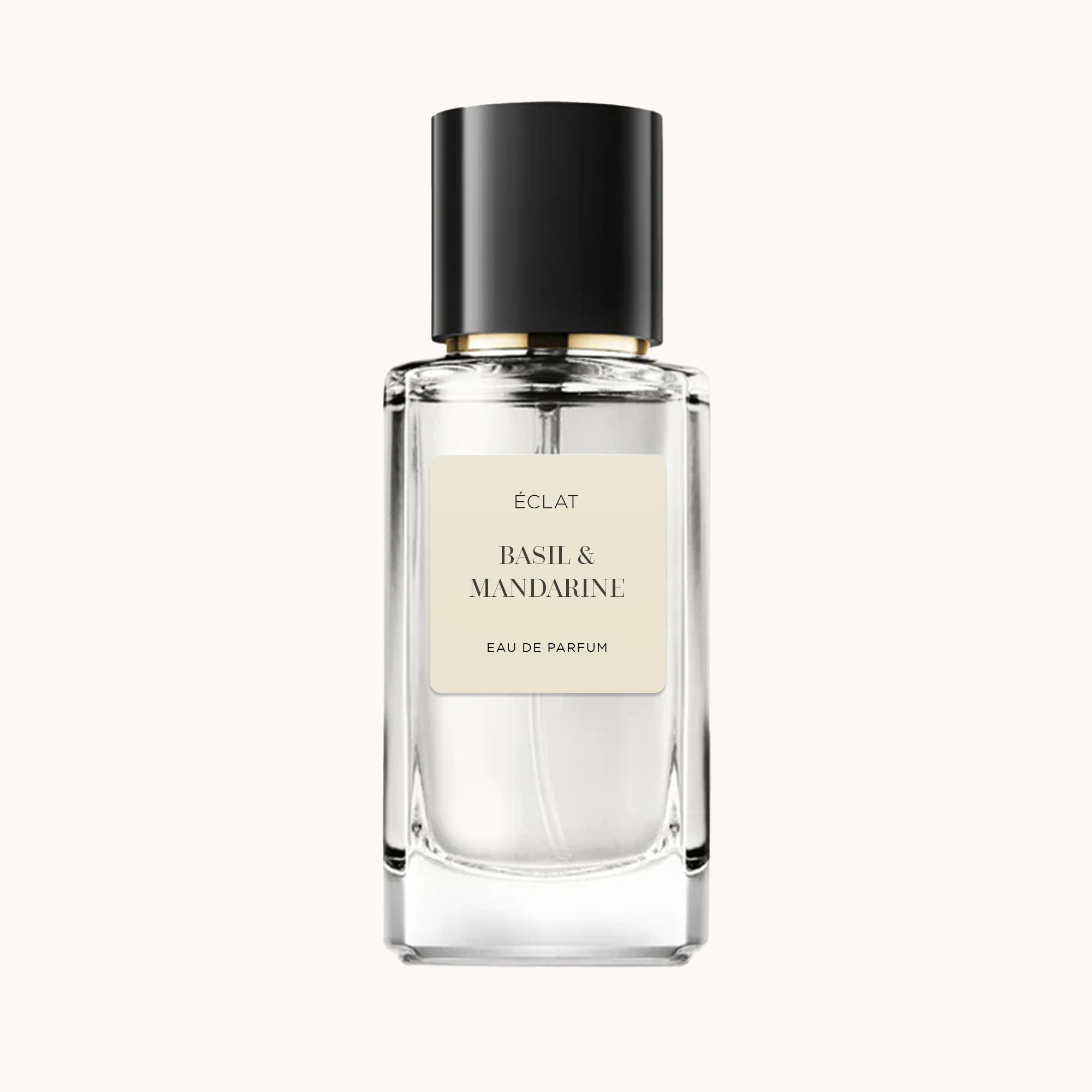 Transparent glass flacon with black cap and cream label for ÉCLAT Basil & Mandarine.