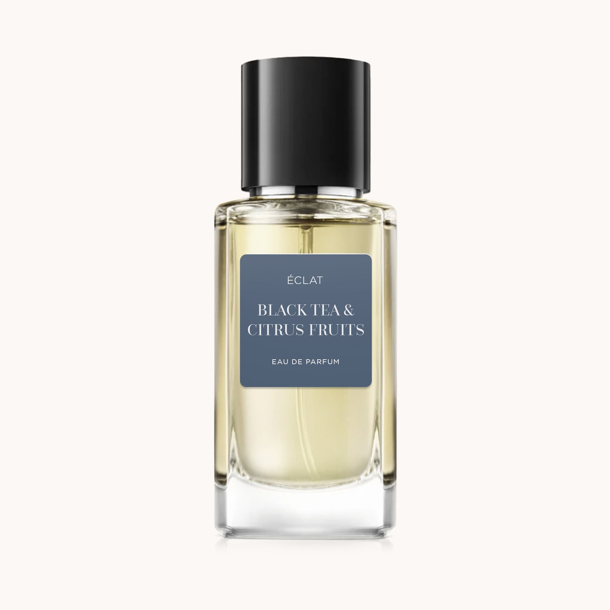 A faceted glass bottle of ÉCLAT Black Tea & Citrus Fruits with a black cap.