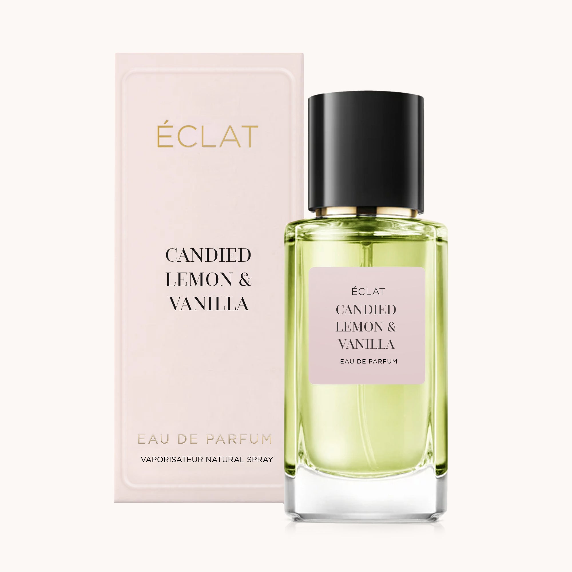 ÉCLAT Candied Lemon & Vanilla perfume bottle with a pastel pink box and black cap.