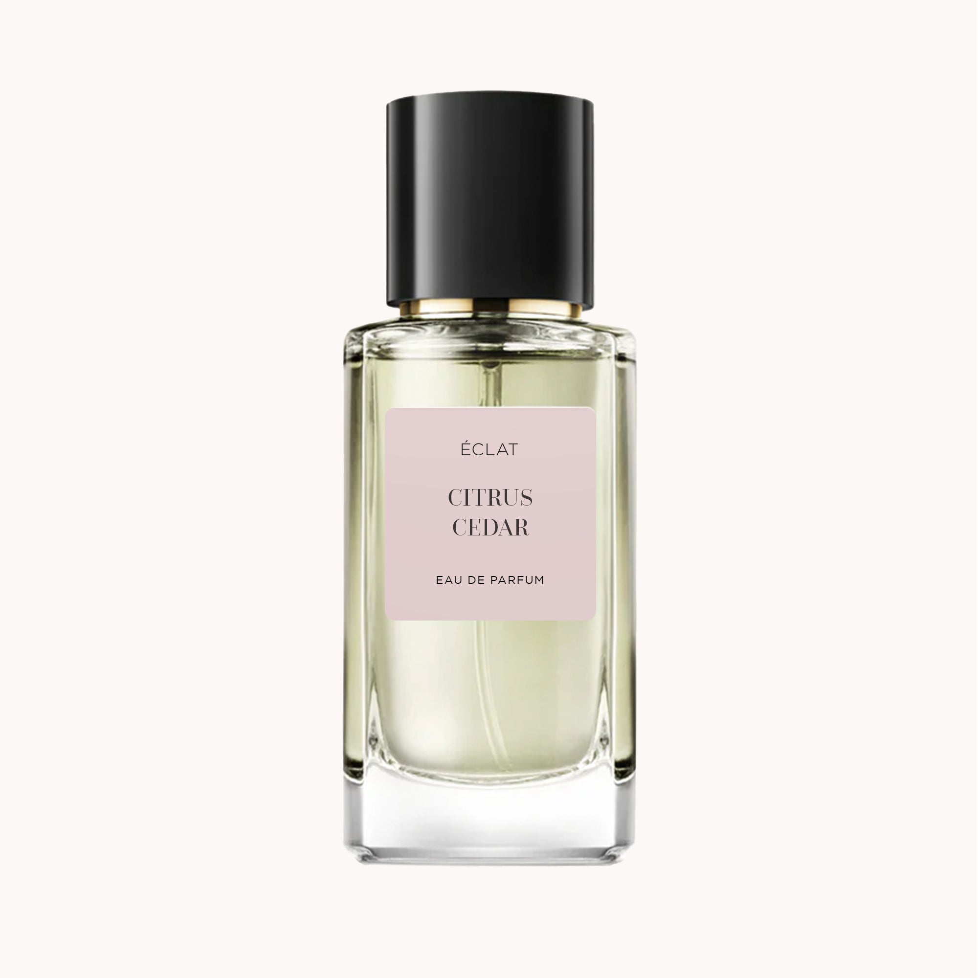 ÉCLAT Citrus Cedar in a faceted glass bottle with a black cap and a pastel label in the center.