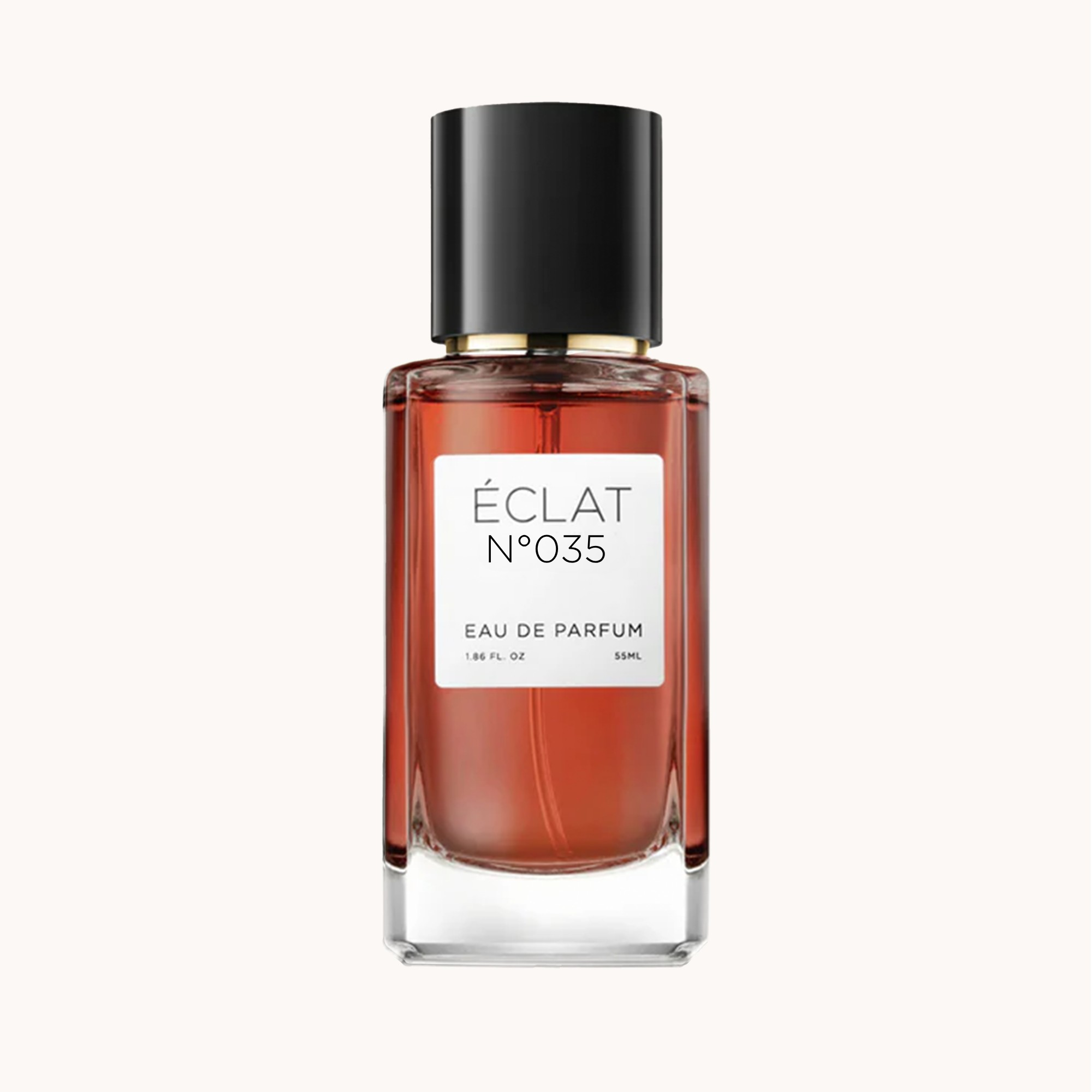 Fasettslipad glasflaska med svart lock, innehållande ÉCLAT Creamy Tuberose, med vit etikett.