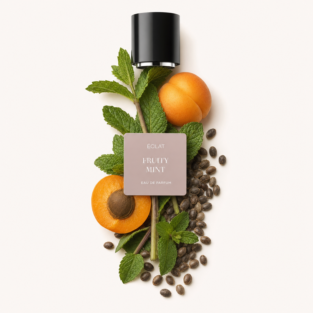 An arrangement of fresh mint leaves, apricots, and seeds encircle a black cap with a label reading ÉCLAT Fruity Mint.