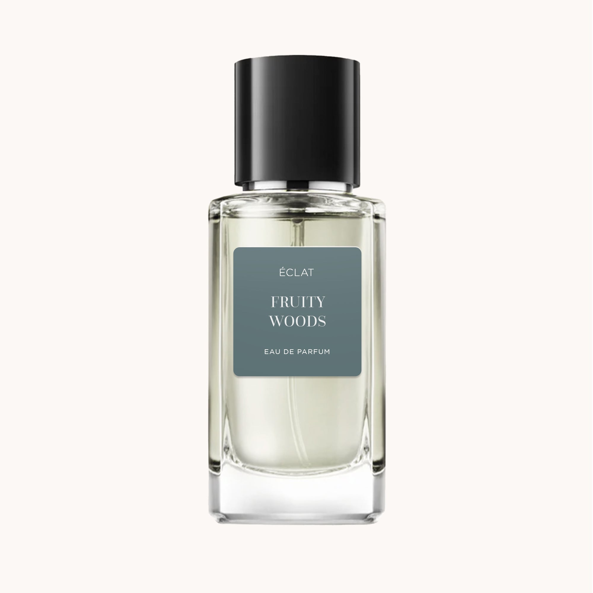 Elegante frasco de vidrio de ÉCLAT Fruity Woods con tapa negra y etiqueta gris minimalista.