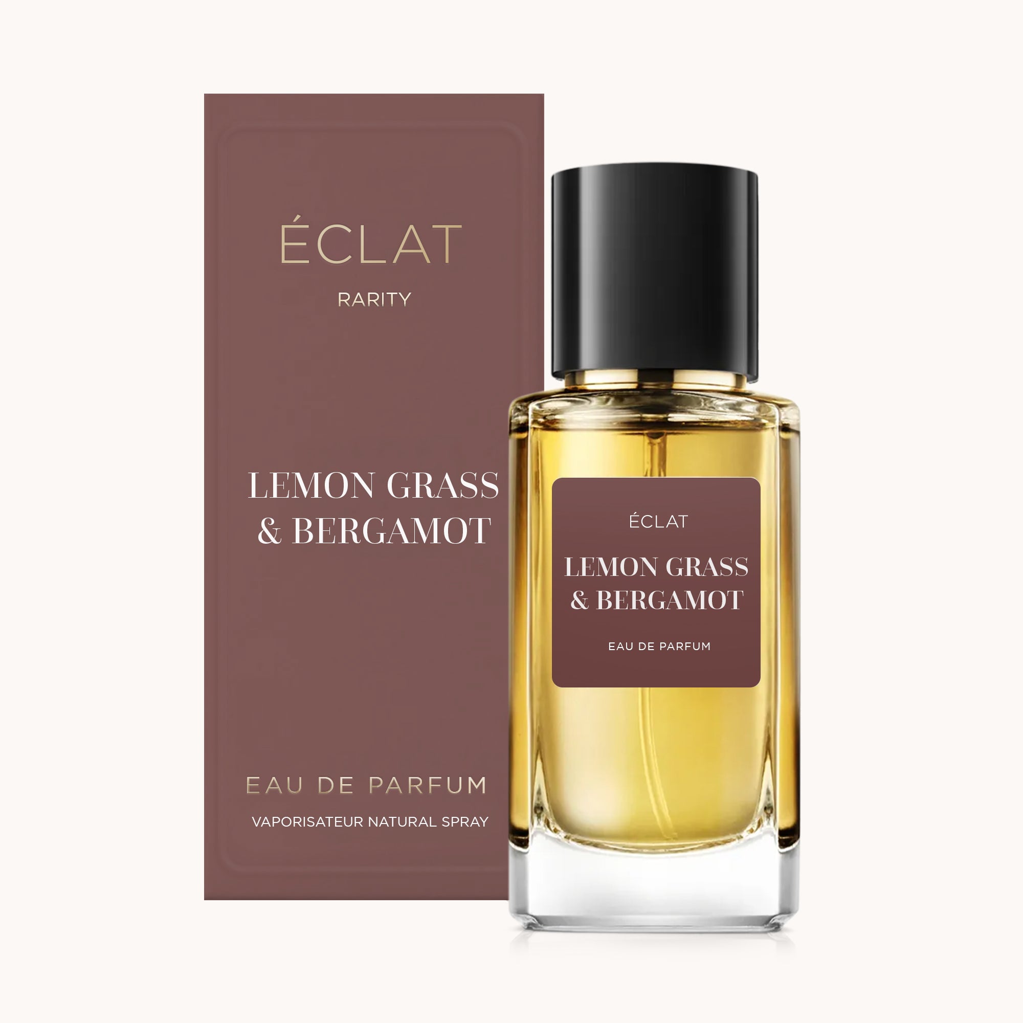 O ÉCLAT Lemon Grass & Bergamot RAR apresenta um frasco de vidro facetado com tampa preta e uma embalagem elegante a condizer em tons de castanho profundo.
