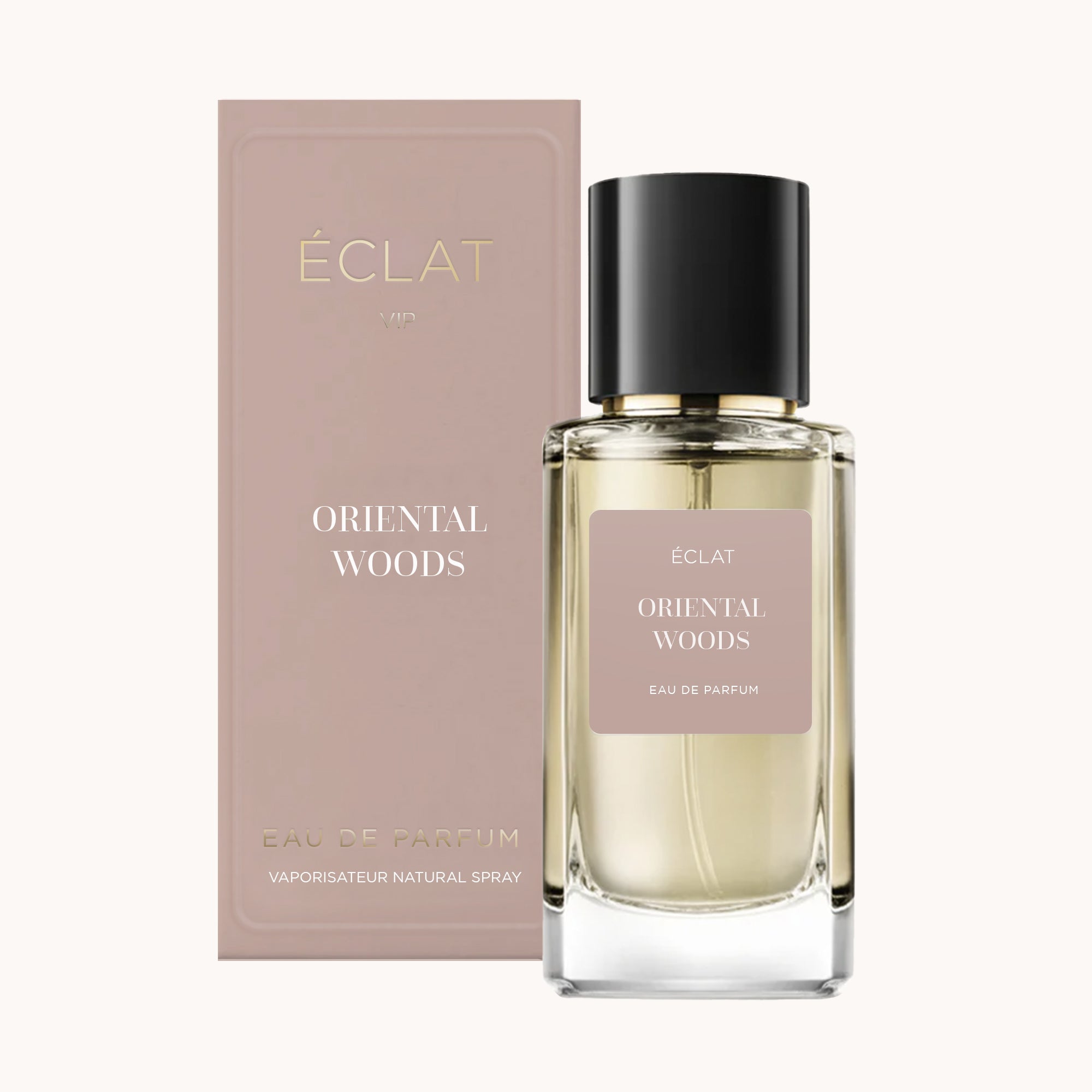 Flacon de parfum ÉCLAT Oriental Woods avec un capuchon noir et une étiquette beige, à côté de sa boîte beige assortie.