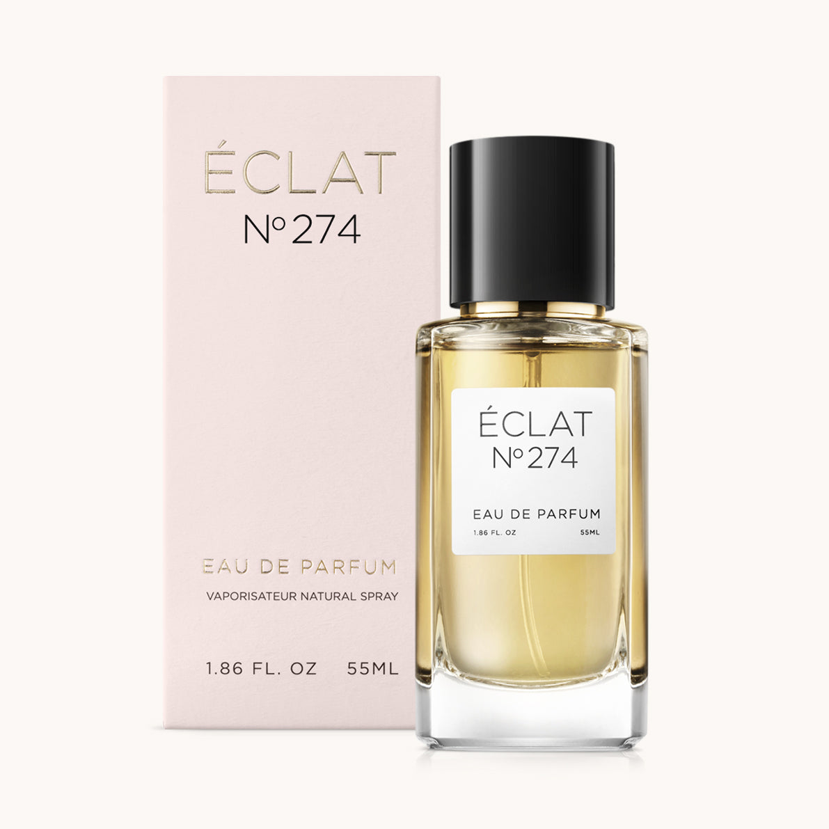 Frasco de vidro facetado de ÉCLAT Powdery Almond com tampa preta, acompanhado por uma elegante caixa rosa pálido.