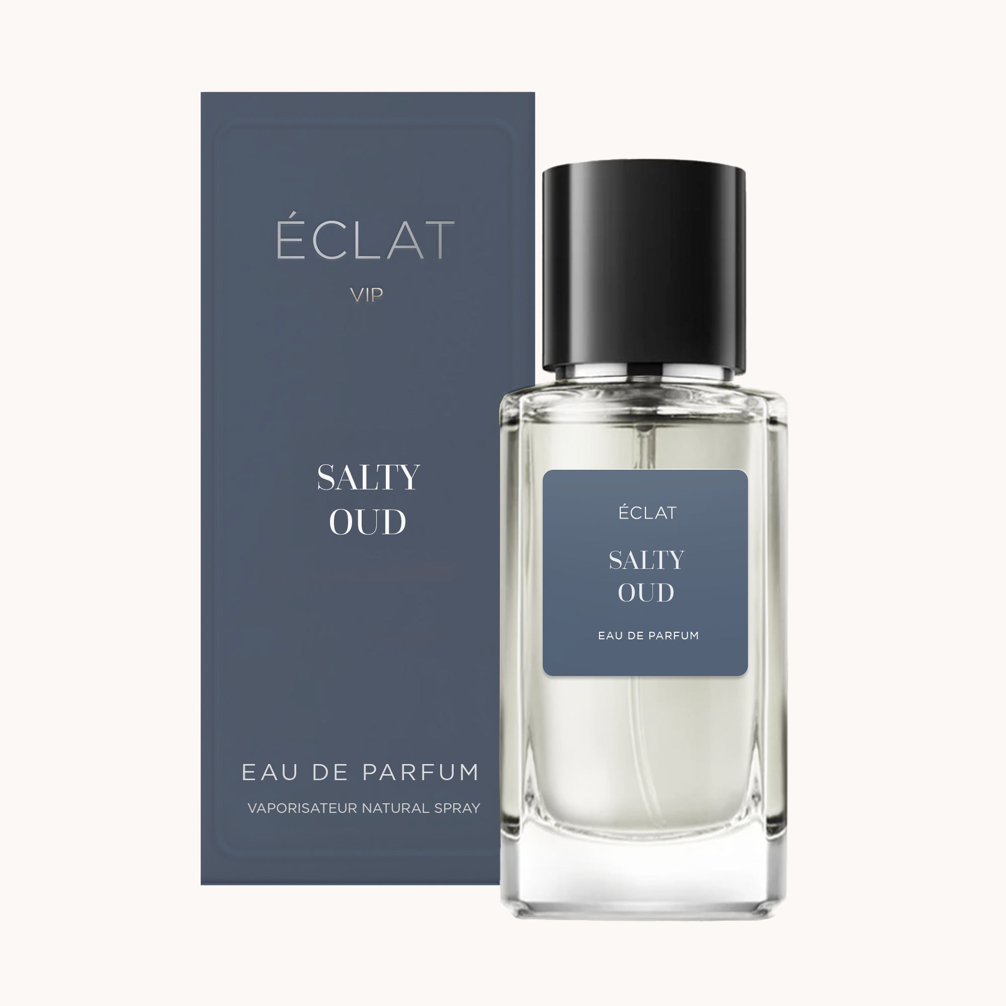 Frasco de vidro ÉCLAT Salty Oud VIP com rótulo azul escuro e tampa preta, apresentado ao lado de uma caixa correspondente.