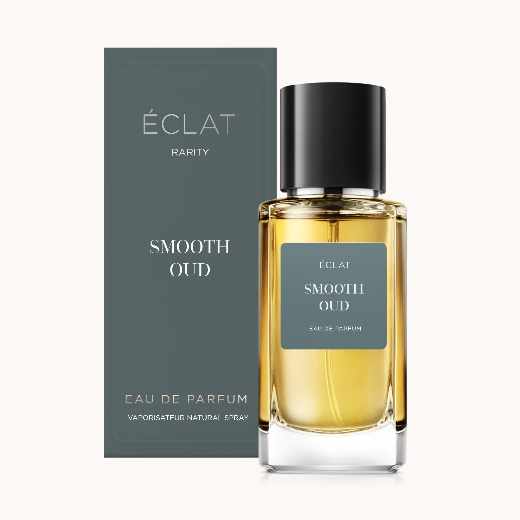 O frasco de perfume ÉCLAT Smooth Oud com tampa preta, acompanhado da sua elegante caixa cinzenta.