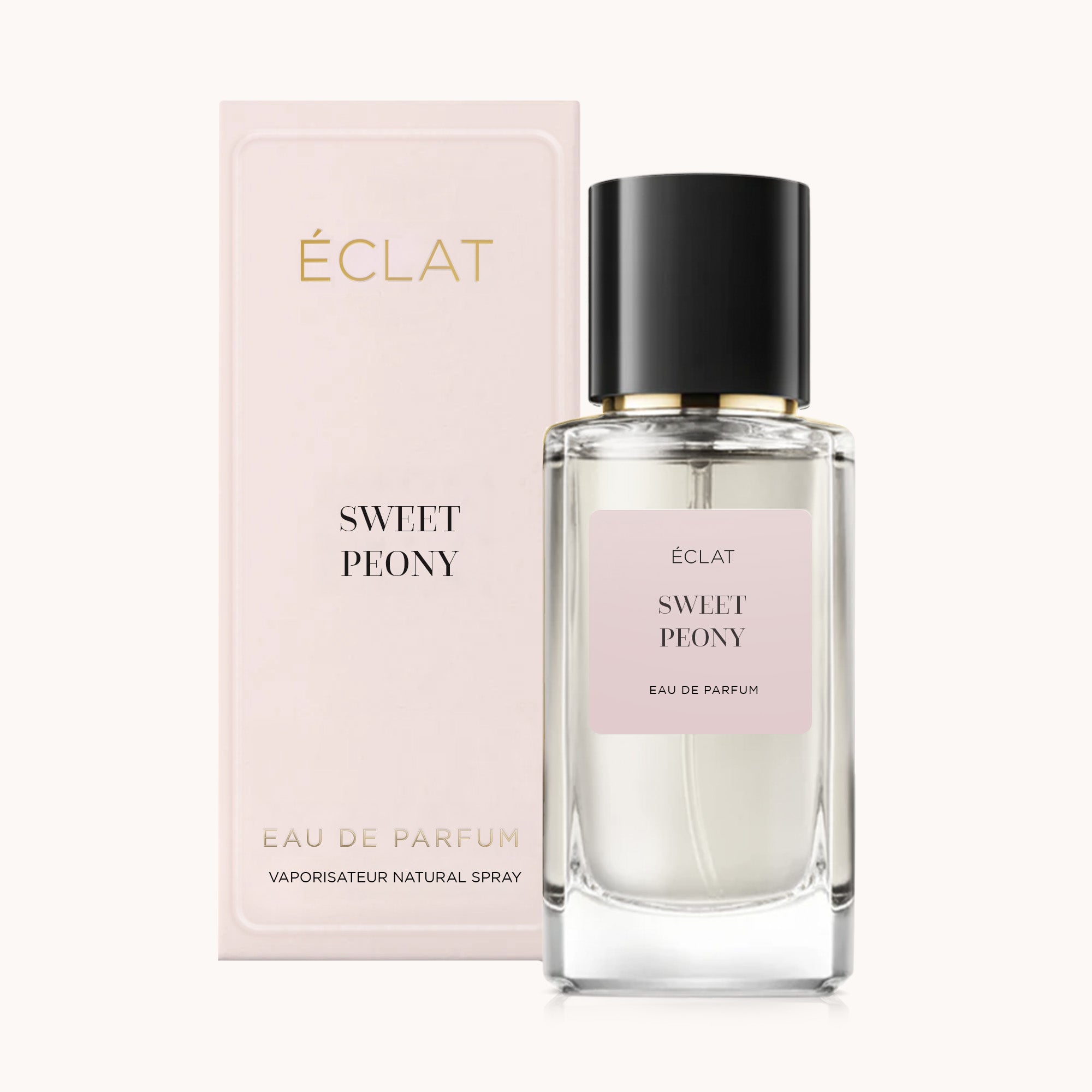 ÉCLAT Sweet Peony fragrance in a clear glass bottle with a black cap, next to a matching pastel pink box.