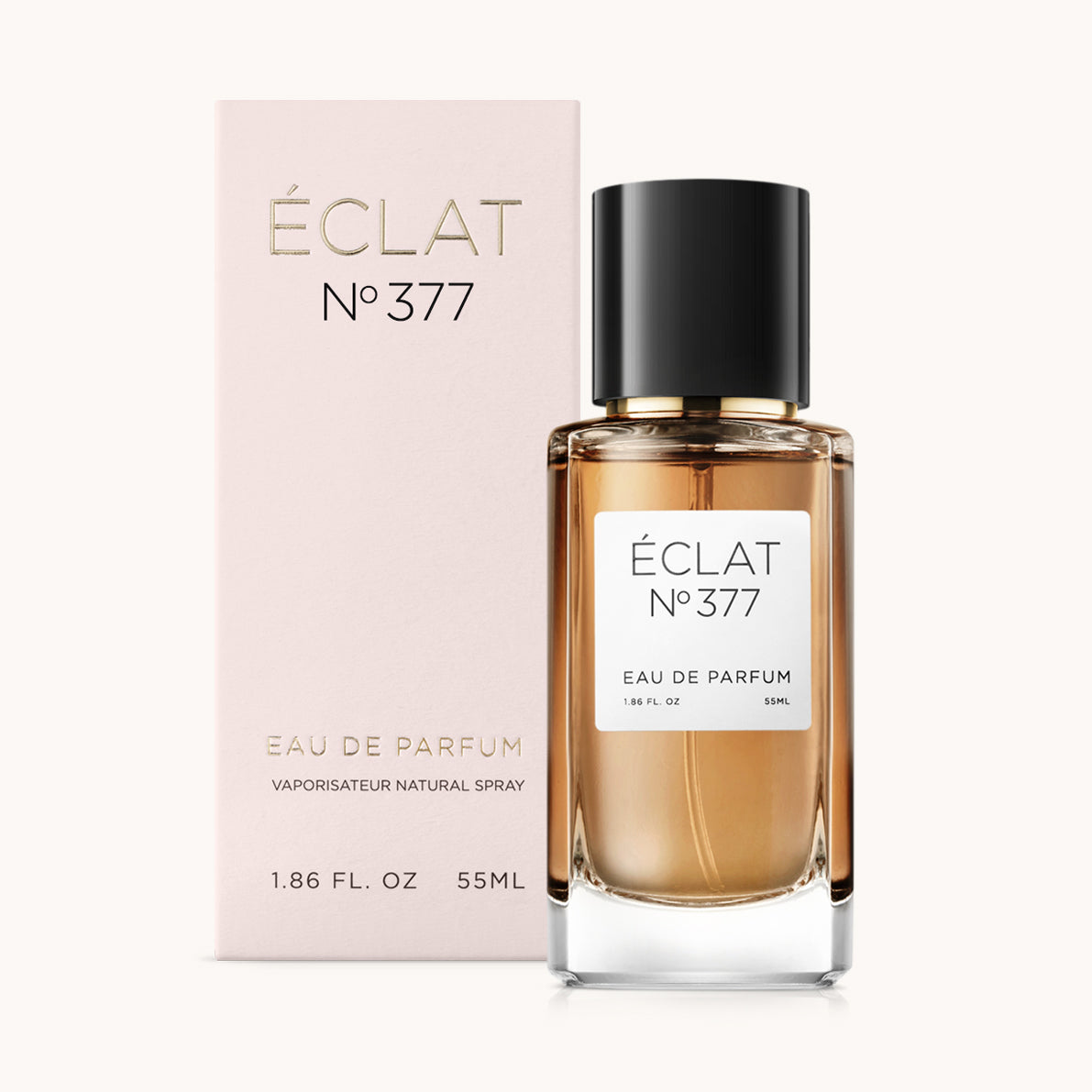 ÉCLAT Vanilla & Popcorn facettált üvegpalackban fekete kupakkal, egy lágy rózsaszín doboz előtt.