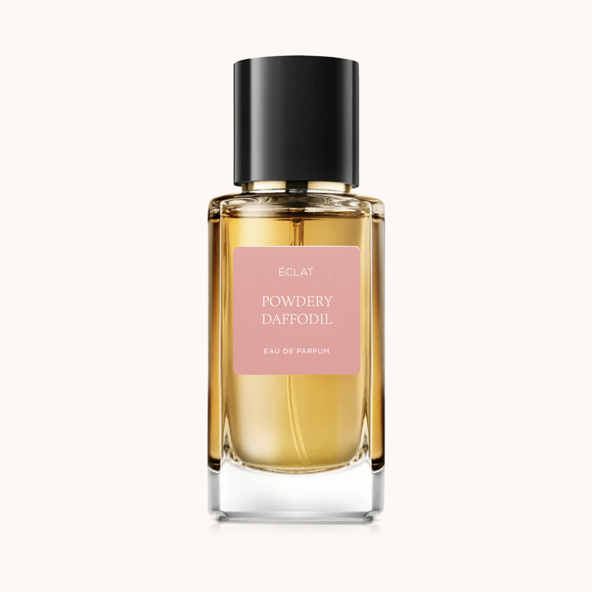 ÉCLAT Powdery Daffodil in a faceted glass bottle with a black cap and a pink matte label.