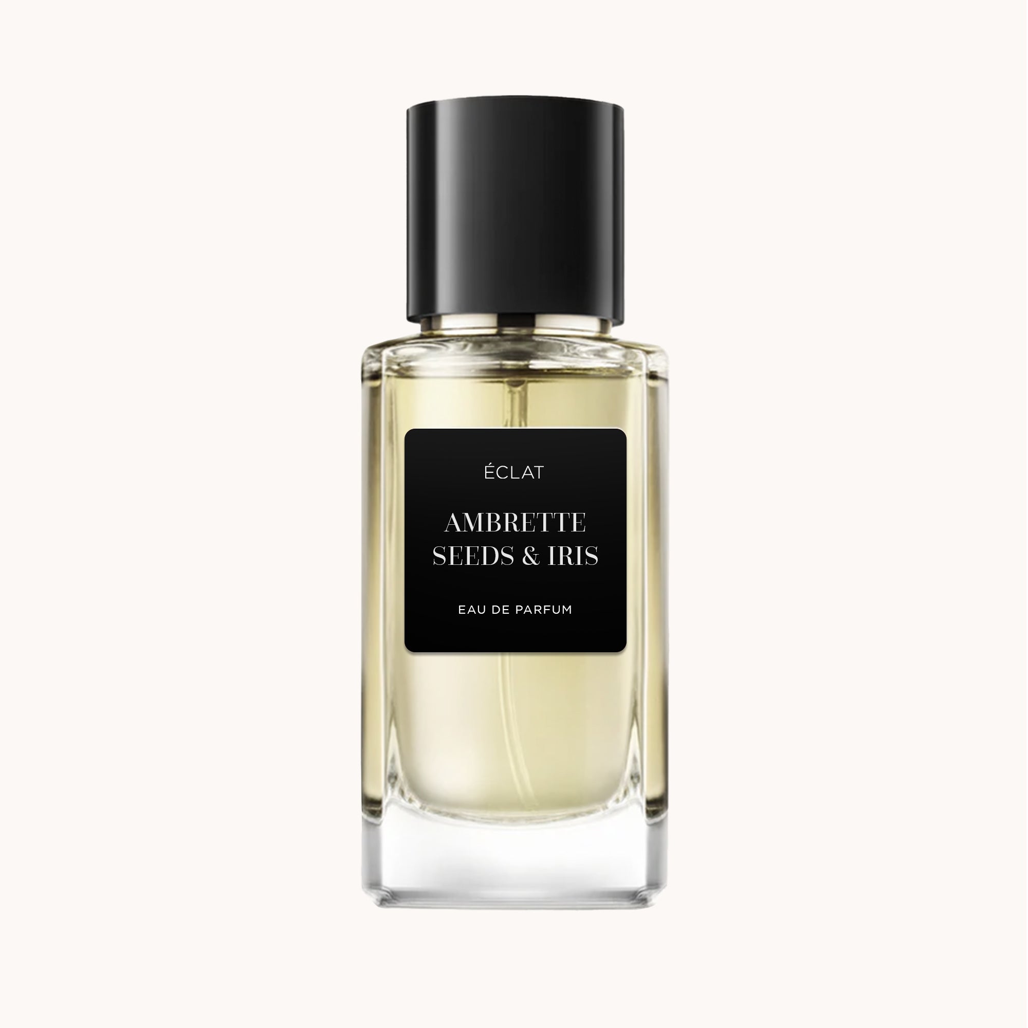 Perfume ÉCLAT Ambrette Seeds & Iris en un frasco de vidrio transparente con tapón negro y etiqueta negra mate.
