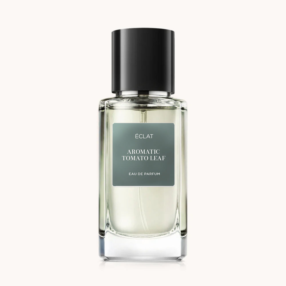 Clear glass bottle with a matte label displaying ÉCLAT Aromatic Tomato Leaf, topped with a black cap.