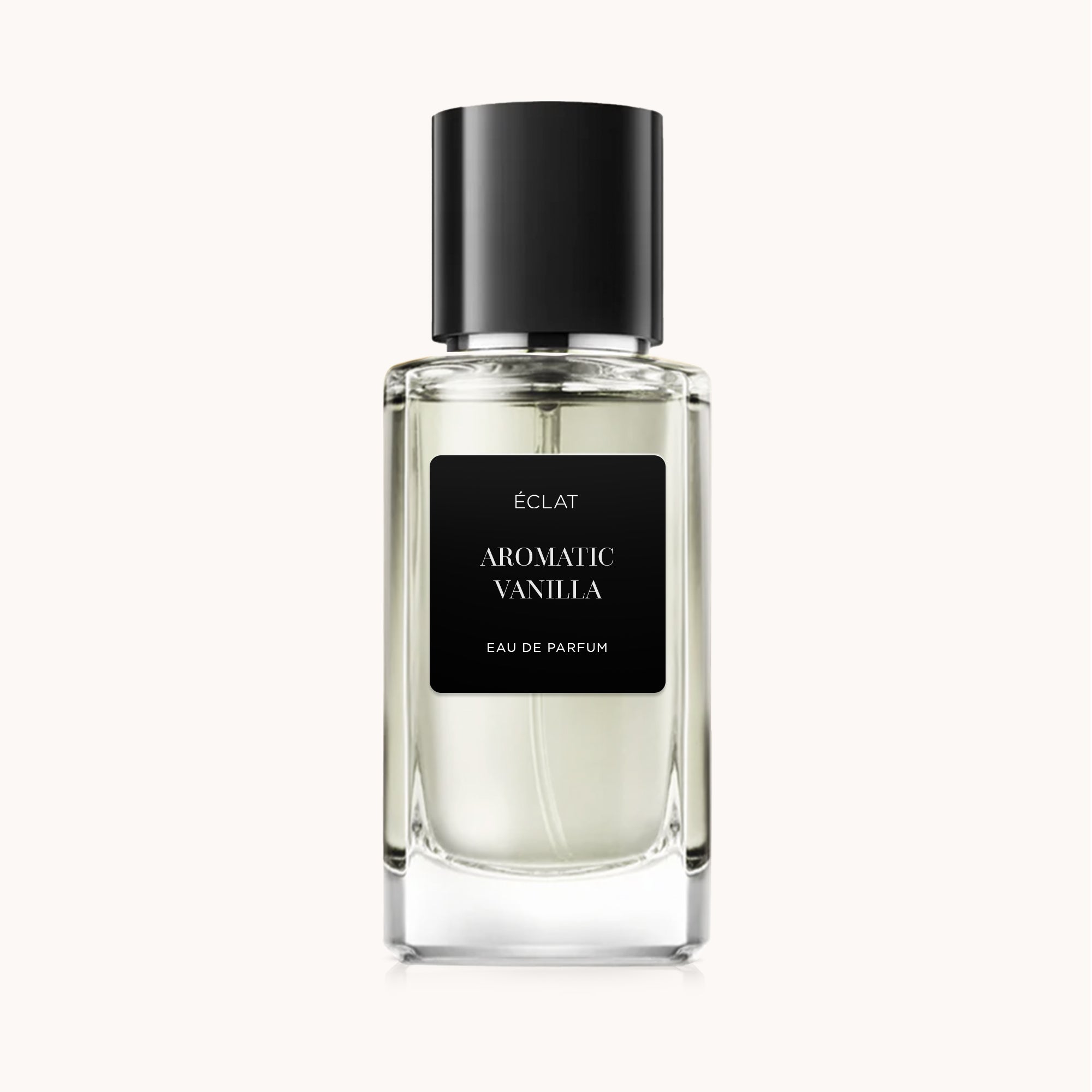 Clear glass bottle of ÉCLAT Aromatic Vanilla with a black label and matching cap.