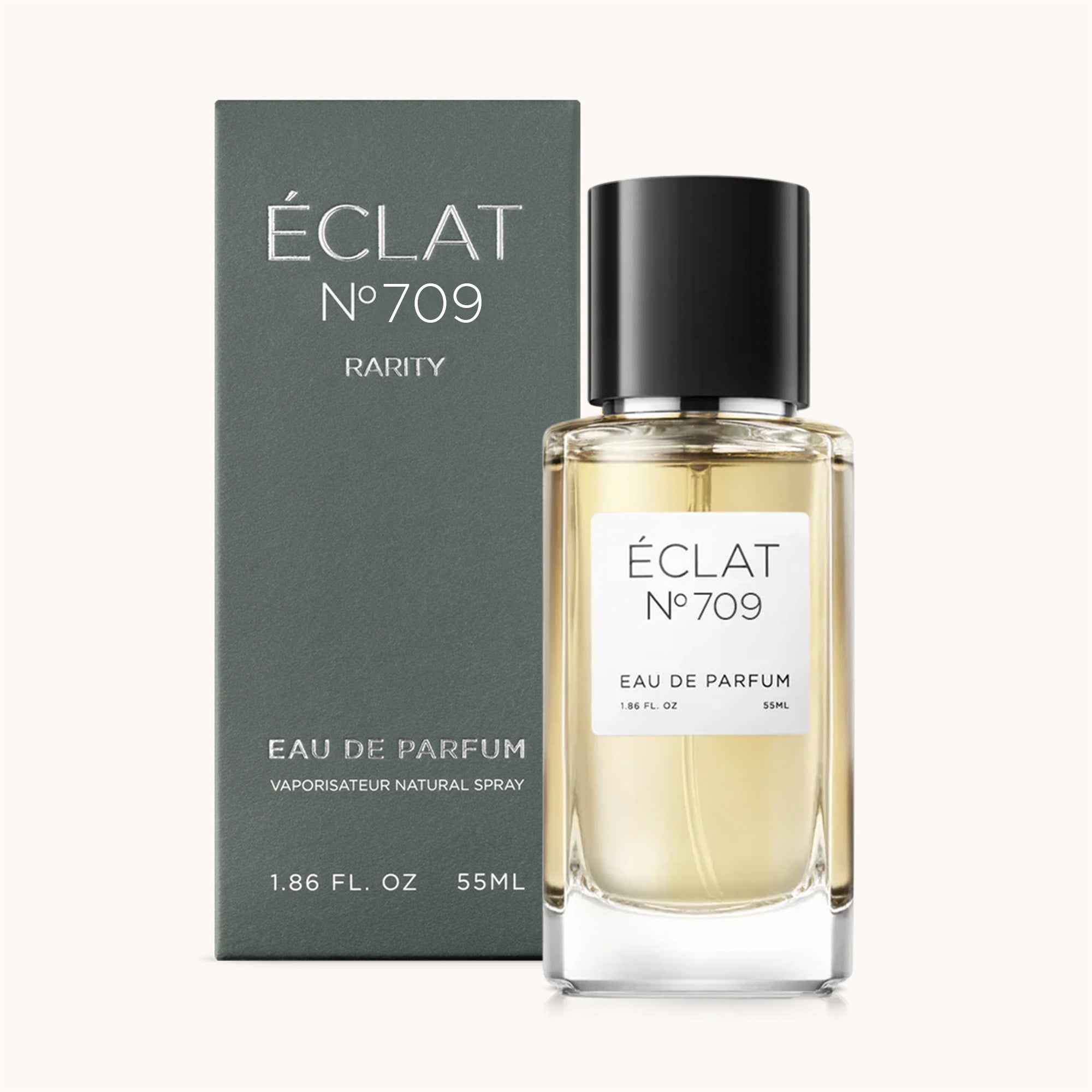 ÉCLAT Black Tea & Cedar presentado en un frasco de vidrio facetado con tapa negra, junto a una elegante caja oscura.