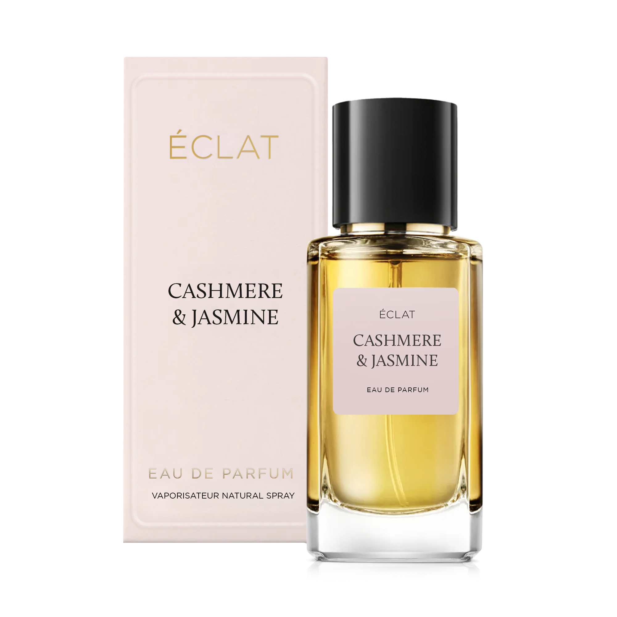 Faceted glass flacon with a soft pink label and black cap, next to an elegant box with ÉCLAT Cashmere & Jasmine.