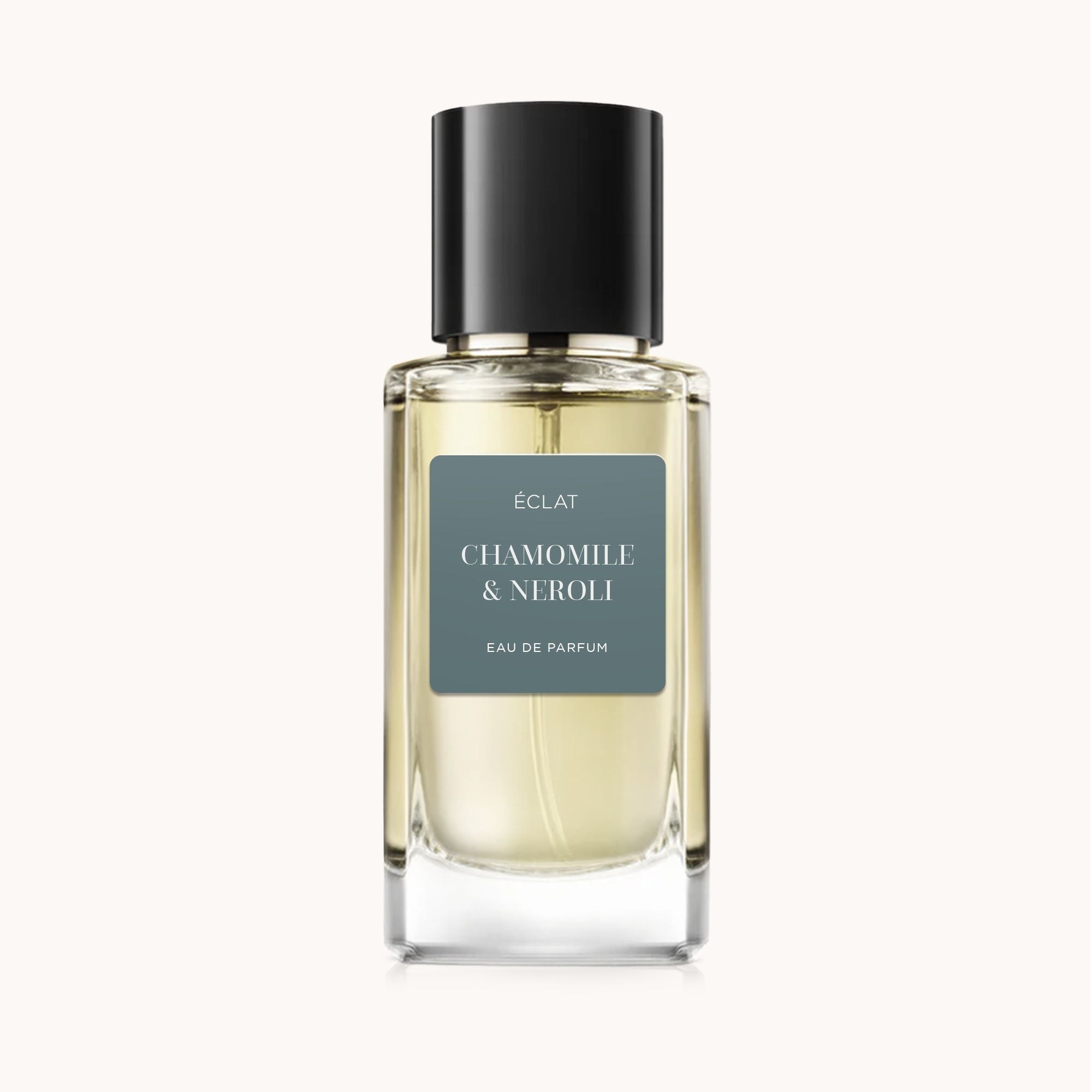 ÉCLAT Chamomile & Neroli in a clear glass bottle with a black cap and a matte label.