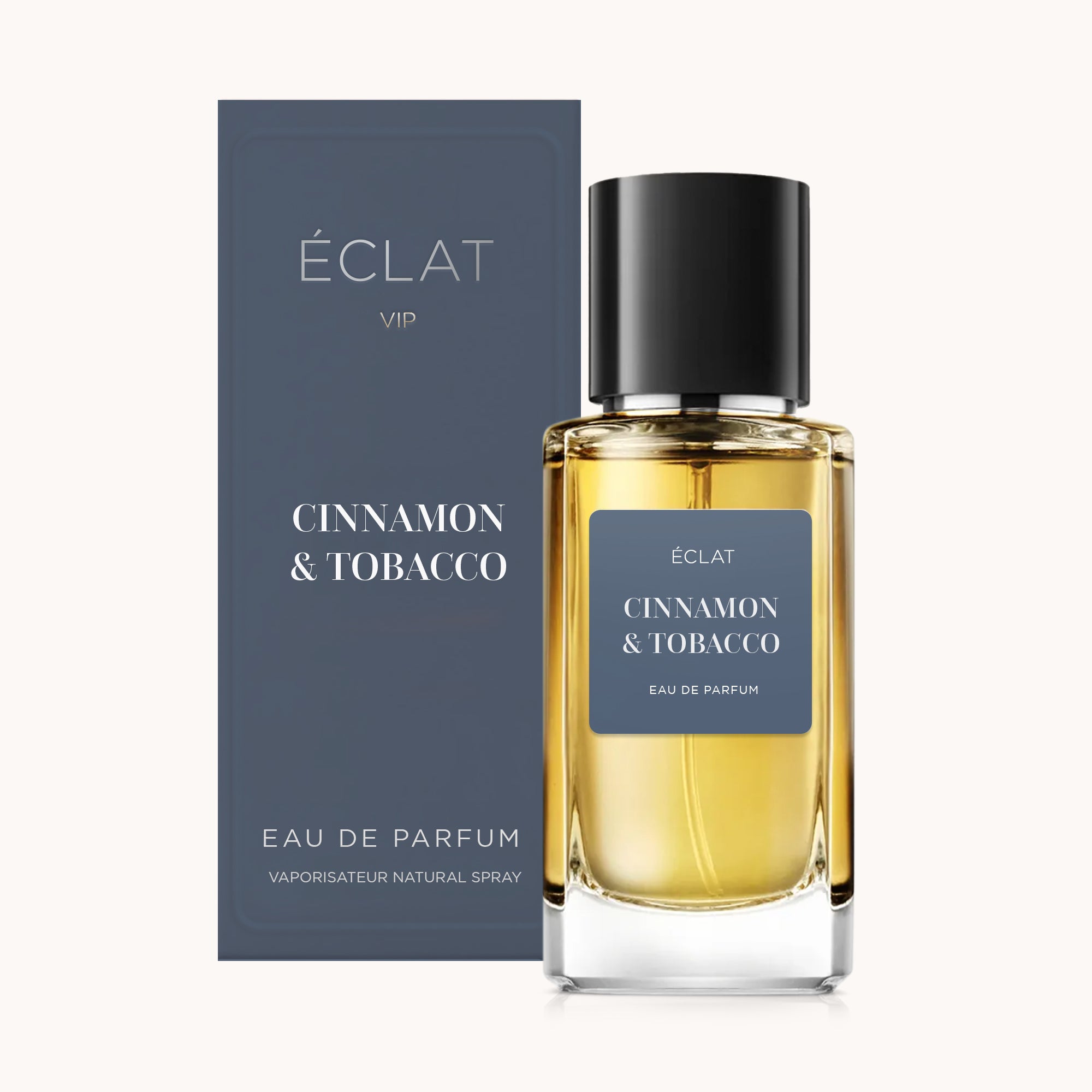 Perfume ÉCLAT Cinnamon & Tobacco com frasco de vidro facetado e tampa preta, acompanhado por uma caixa escura correspondente.