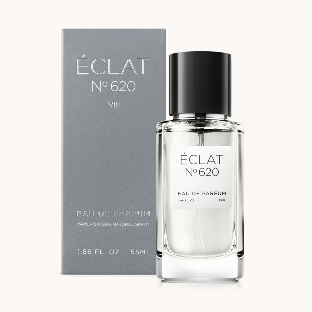 De ÉCLAT Citrus Woods geur is gepresenteerd in een transparante glazen flacon met een zwarte dop, vergezeld van een elegante grijze doos.