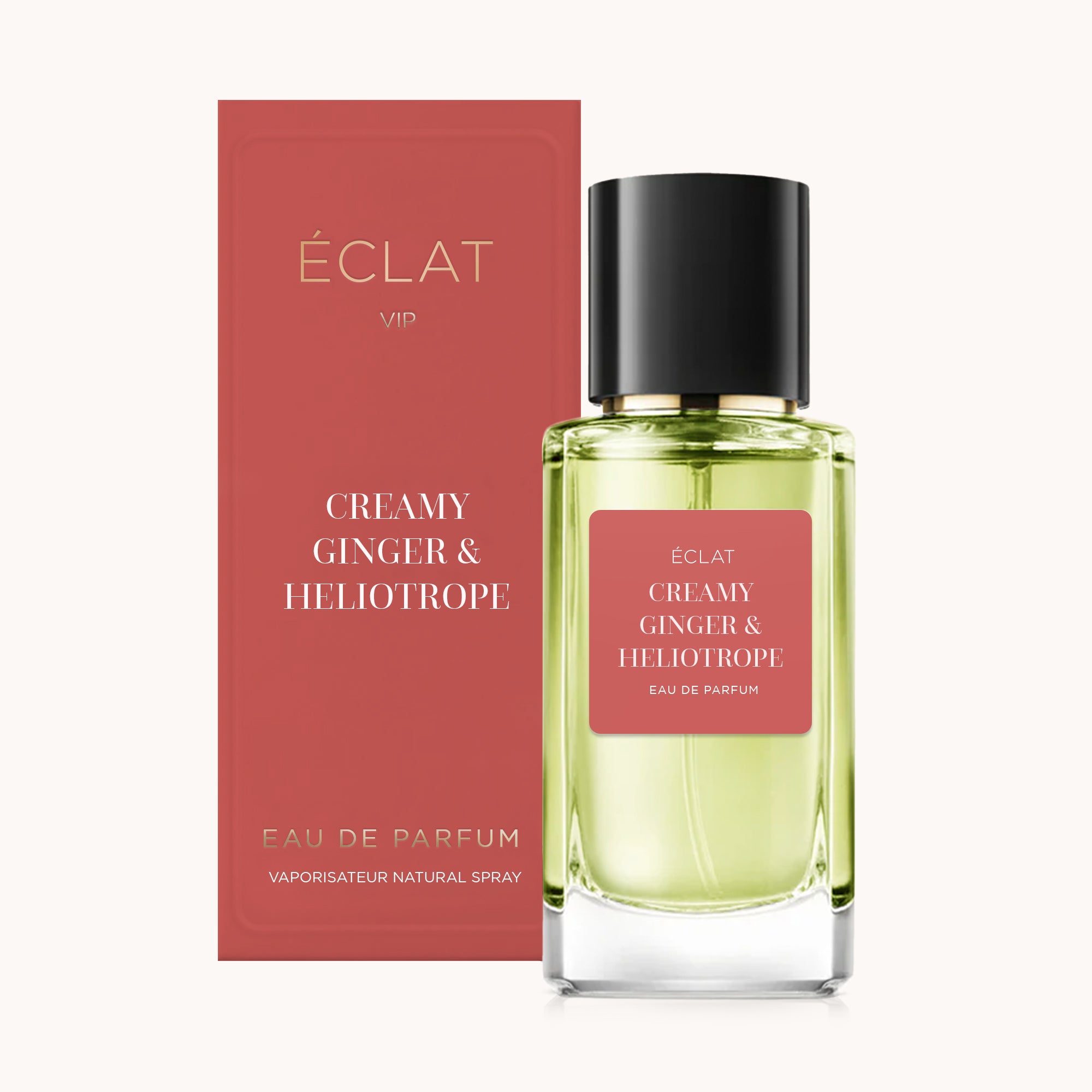 Flacon en verre facetté avec un bouchon noir et une étiquette rouge ÉCLAT Creamy Ginger & Heliotrope, à côté d'une boîte rouge assortie.