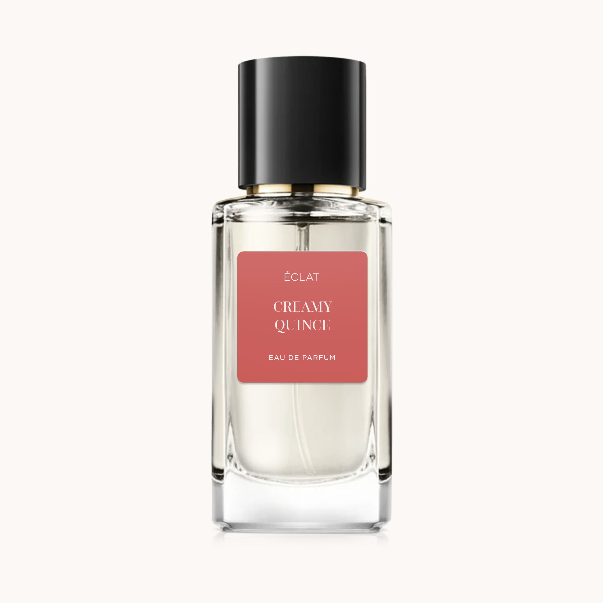 ΕCLAT Creamy Quince σε γυάλινο μπουκάλι με μαύρο καπάκι και κοραλλί ετικέτα.