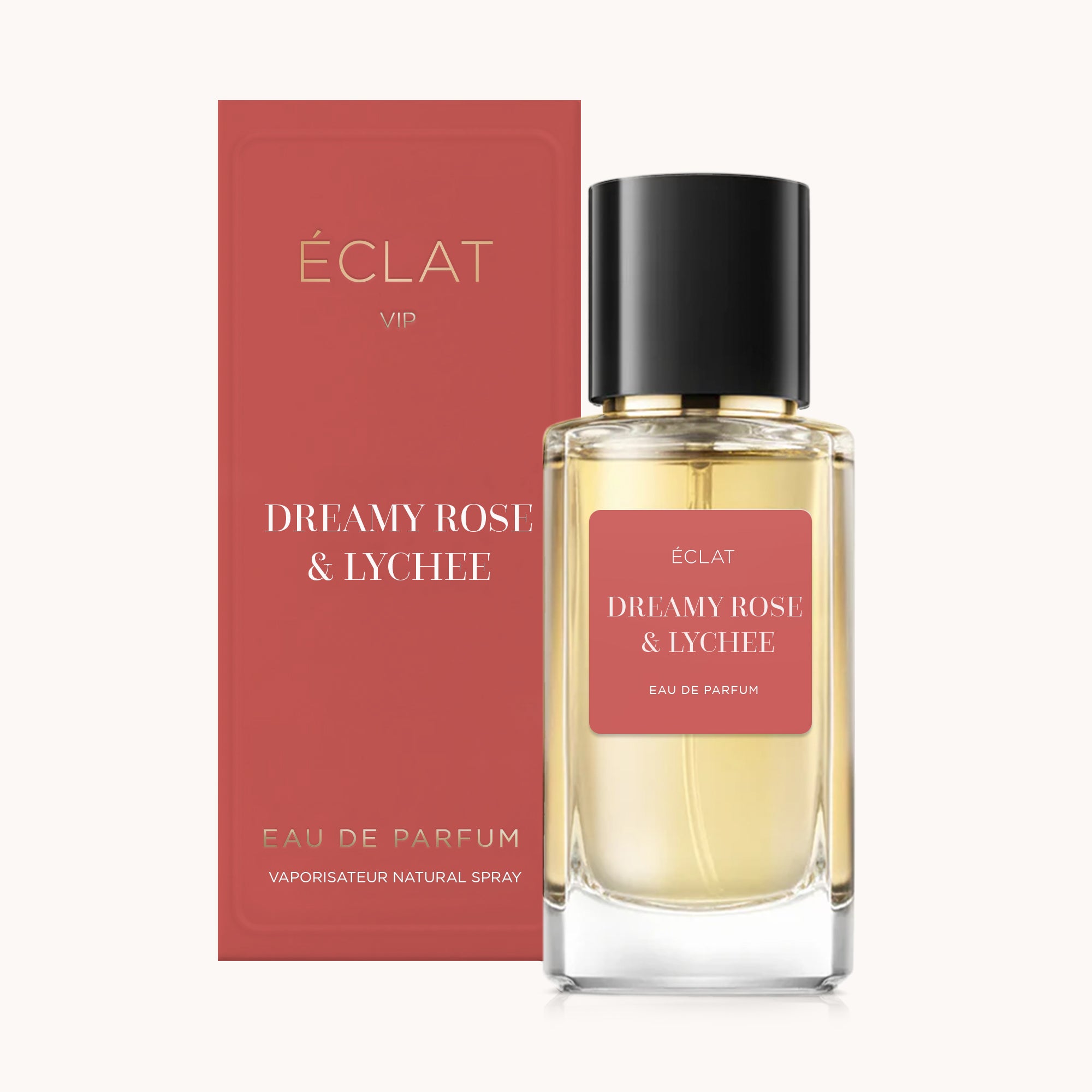 Um frasco de vidro facetado de perfume ÉCLAT Dreamy Rose & Lychee com tampa preta, acompanhado por uma caixa vermelha correspondente.