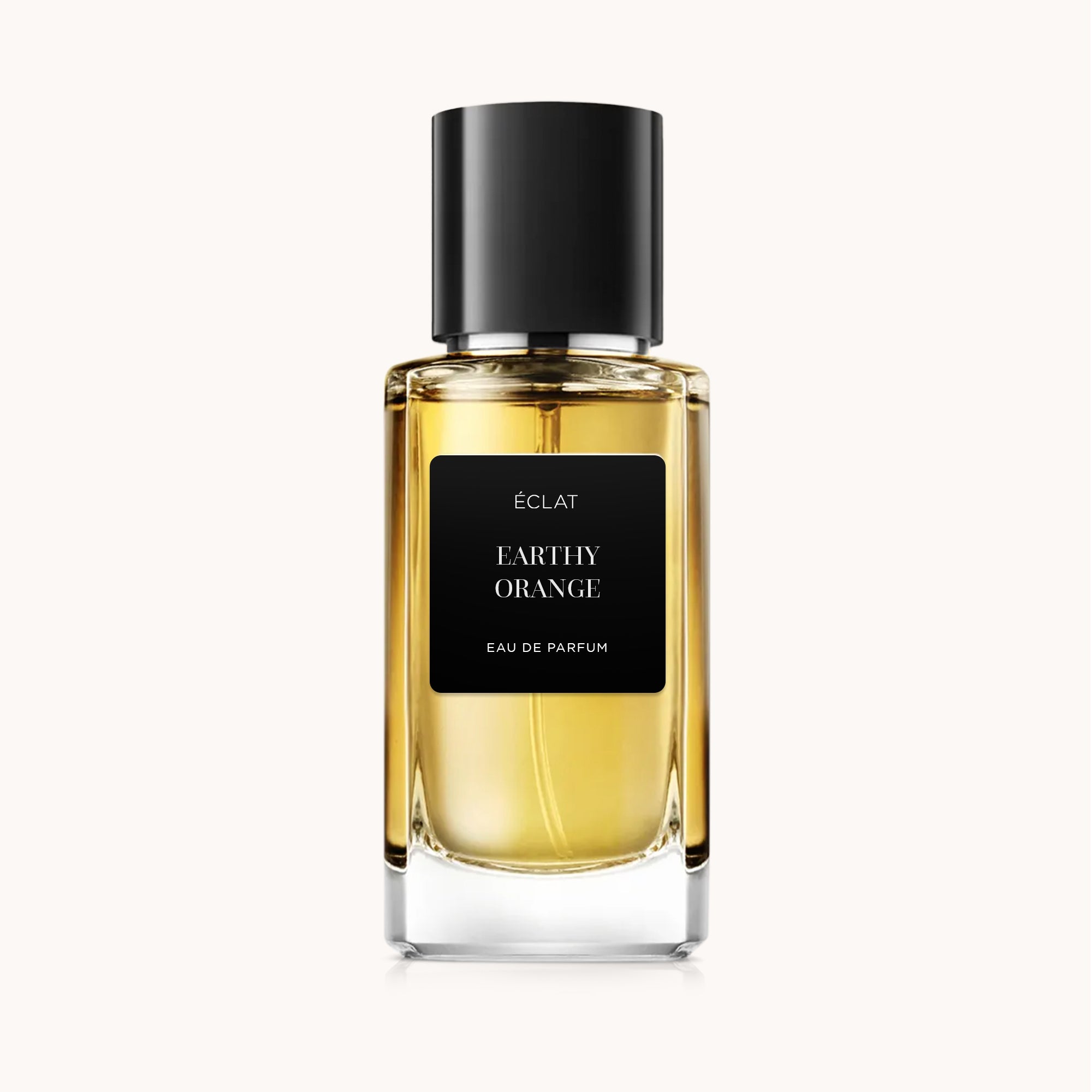 A faceted glass flacon containing ÉCLAT Earthy Orange with a black label and a black cap.