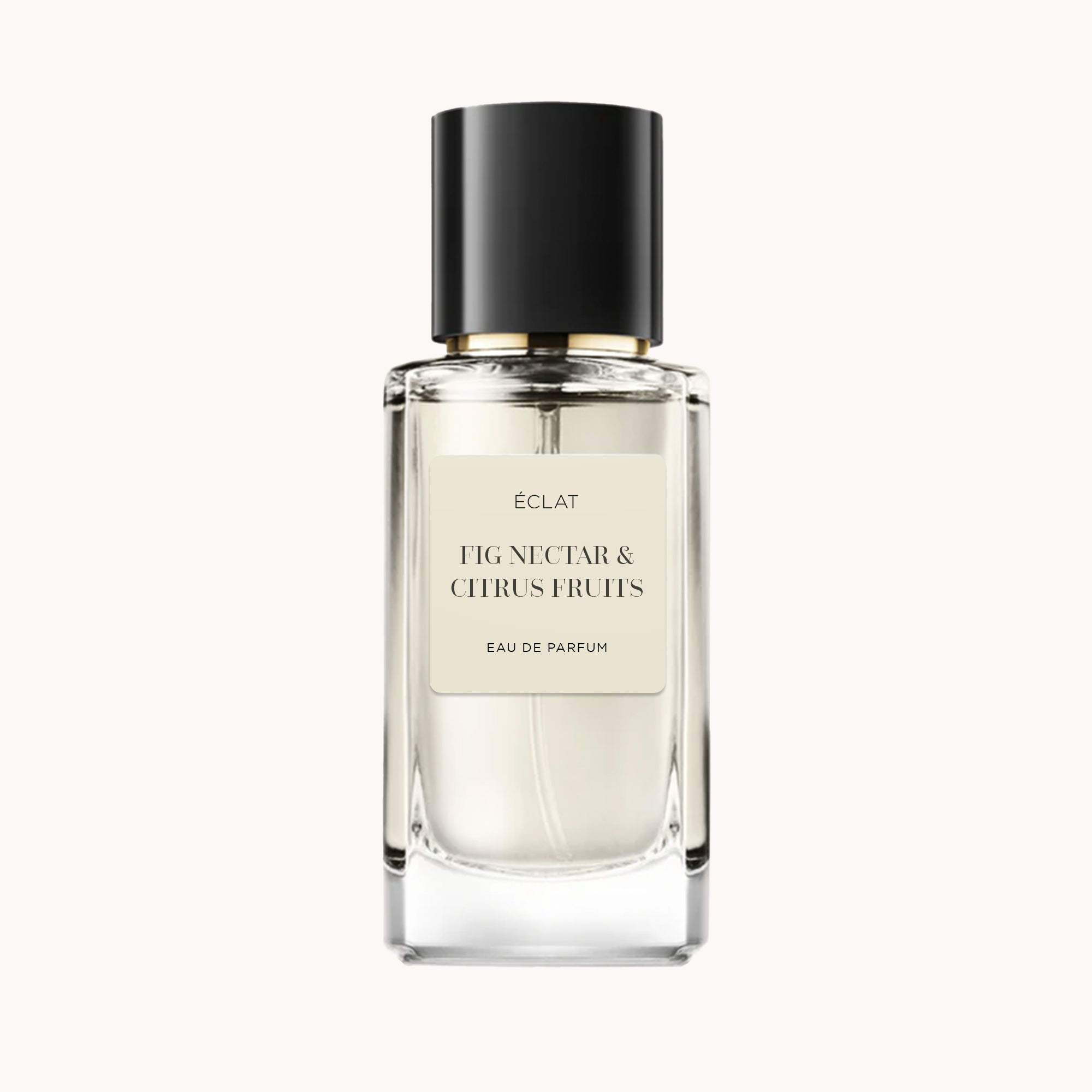 Elegant glass bottle of ÉCLAT Fig Nectar & Citrus Fruits with a black cap and soft beige label.