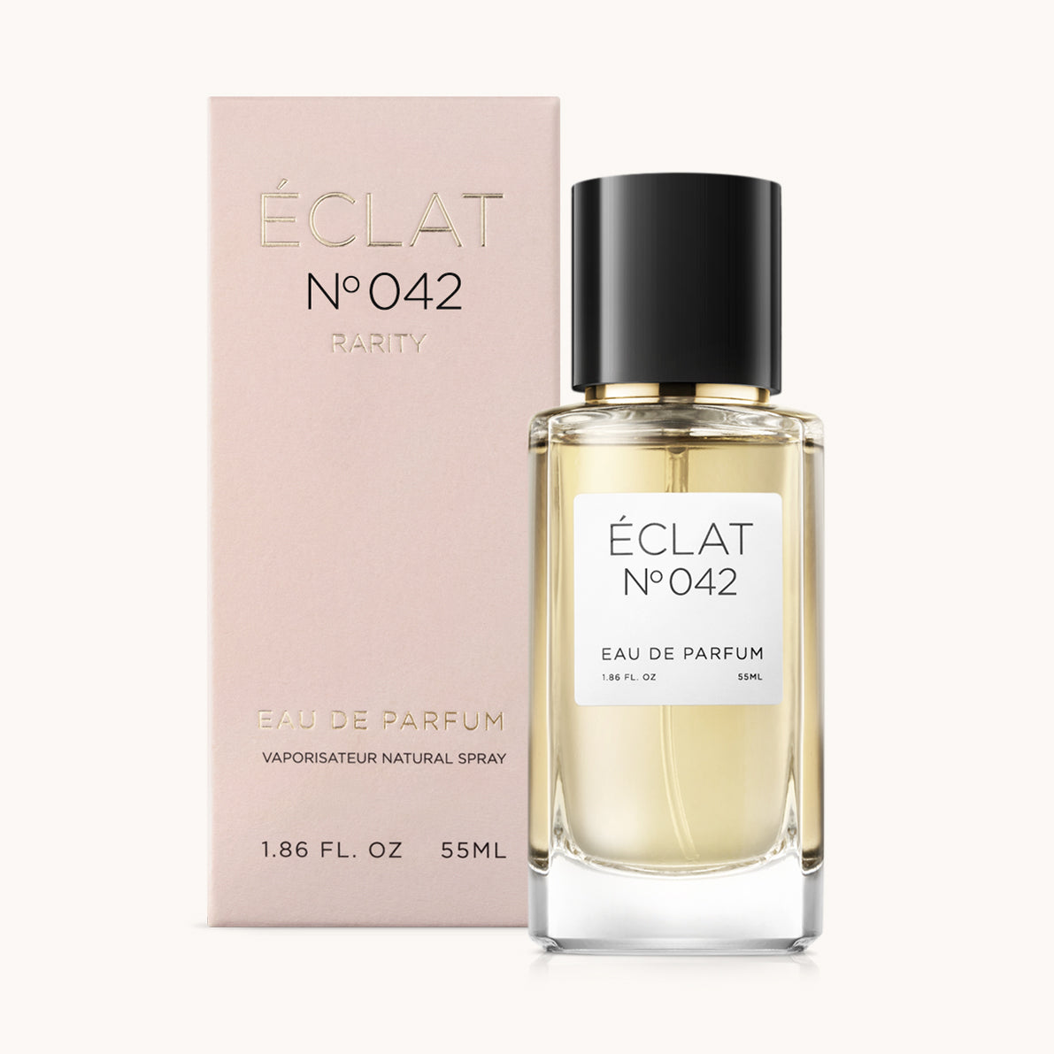 ÉCLAT Floral Green perfume in a faceted glass bottle with a black cap, accompanied by a blush pink box.