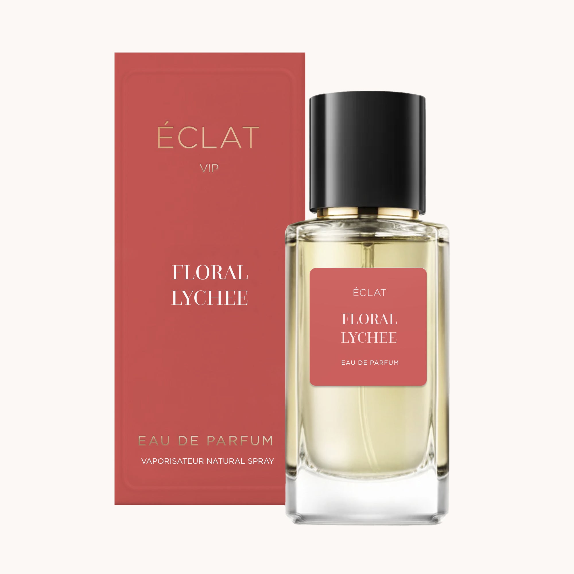 Un flacon en verre facetté ÉCLAT Floral Lychee avec un bouchon noir, accompagné d'une boîte corail debout.
