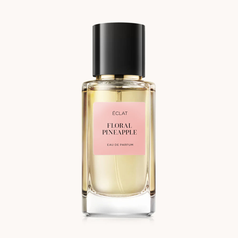 Elegante frasco de vidrio de ÉCLAT Floral Pineapple con tapa negra y etiqueta rosa suave.