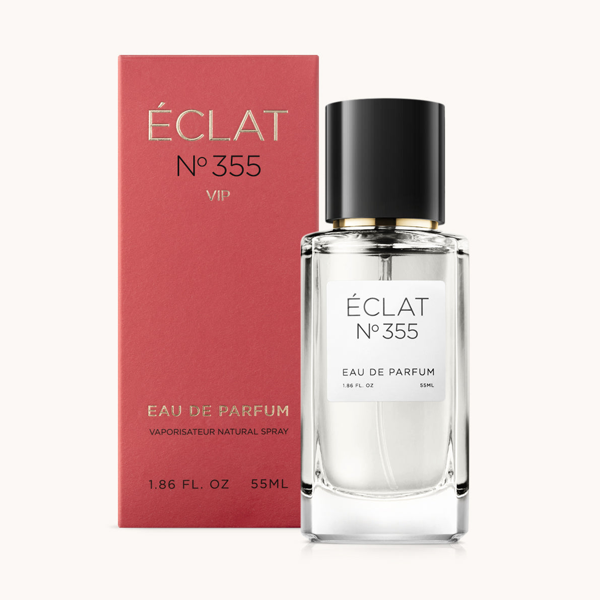 Frasco de vidrio facetado de ÉCLAT VIP Fruity Amber con tapón negro, frente a una caja de presentación roja.