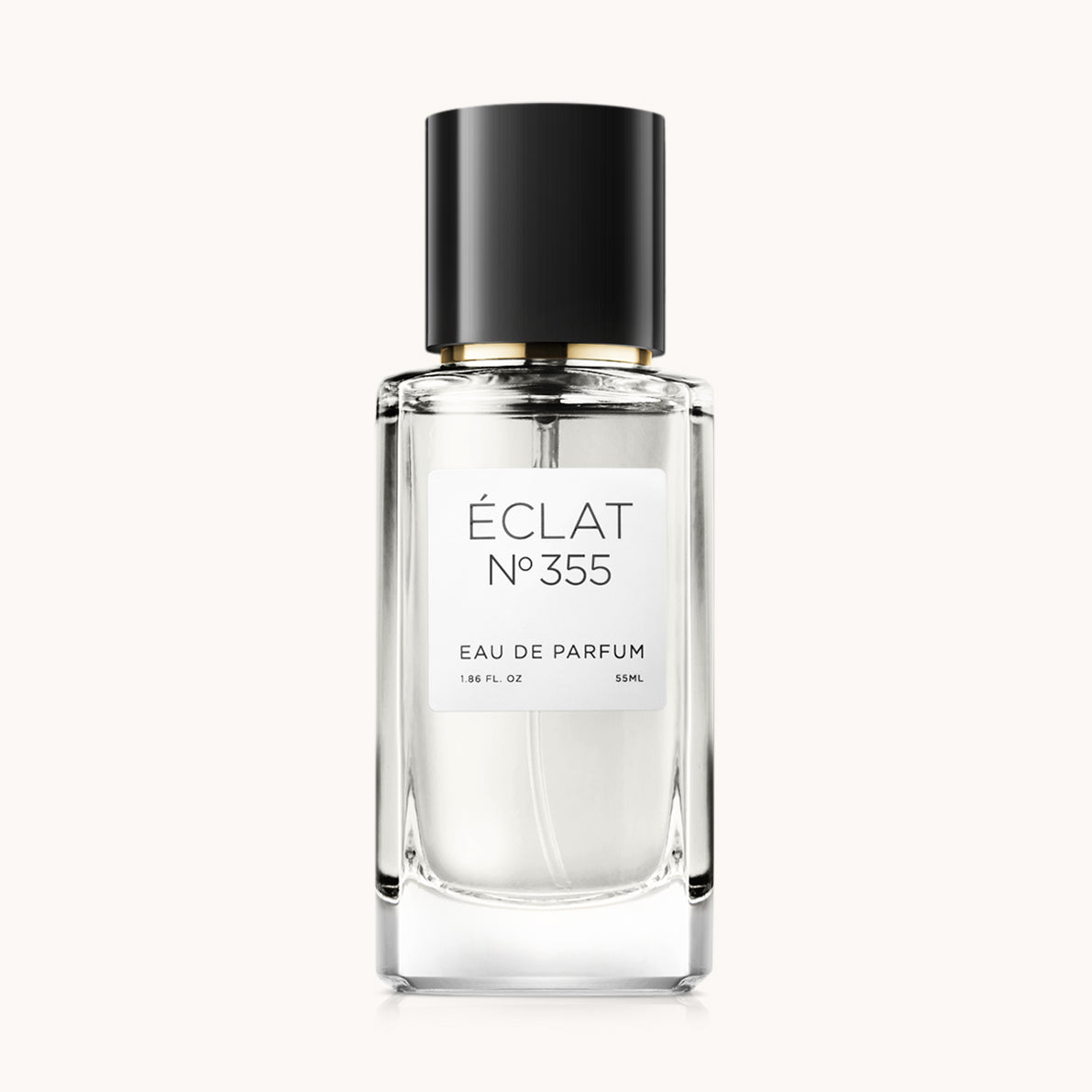 Botella de perfume ÉCLAT VIP Fruity Amber de vidrio transparente con tapa negra.