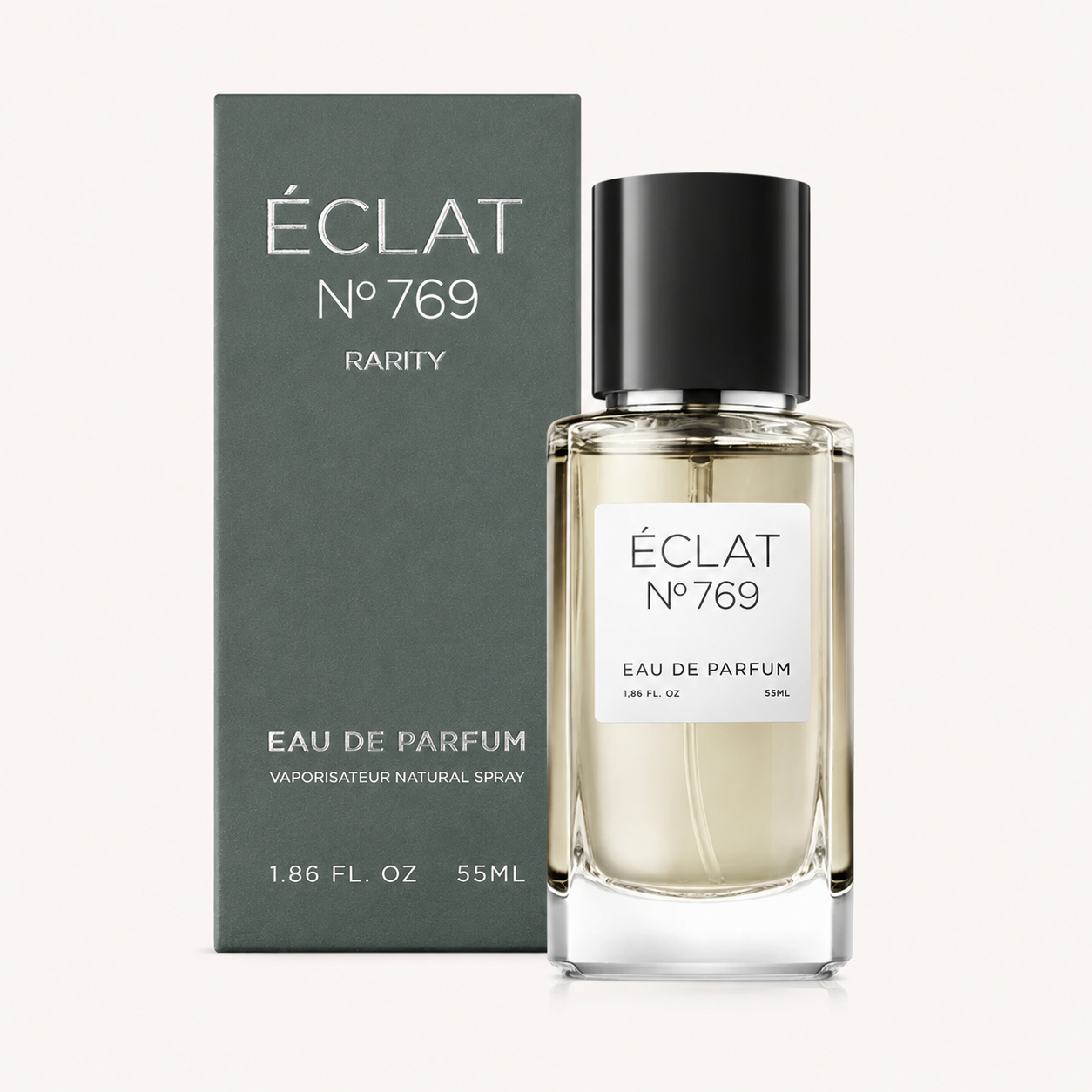 The ÉCLAT Fruity Hazelnut fragrance is presented in a sleek glass bottle with a black cap, alongside an elegant box.