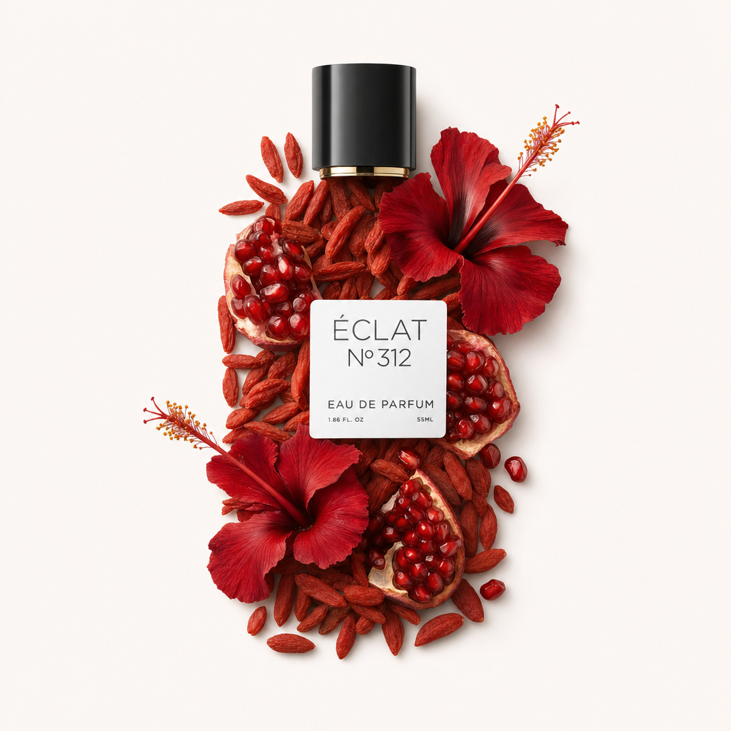 A delicate arrangement of vibrant red hibiscus flowers, pomegranate seeds, and goji berries surrounds the original black cap with ÉCLAT Fruity Hibiskus labeling.