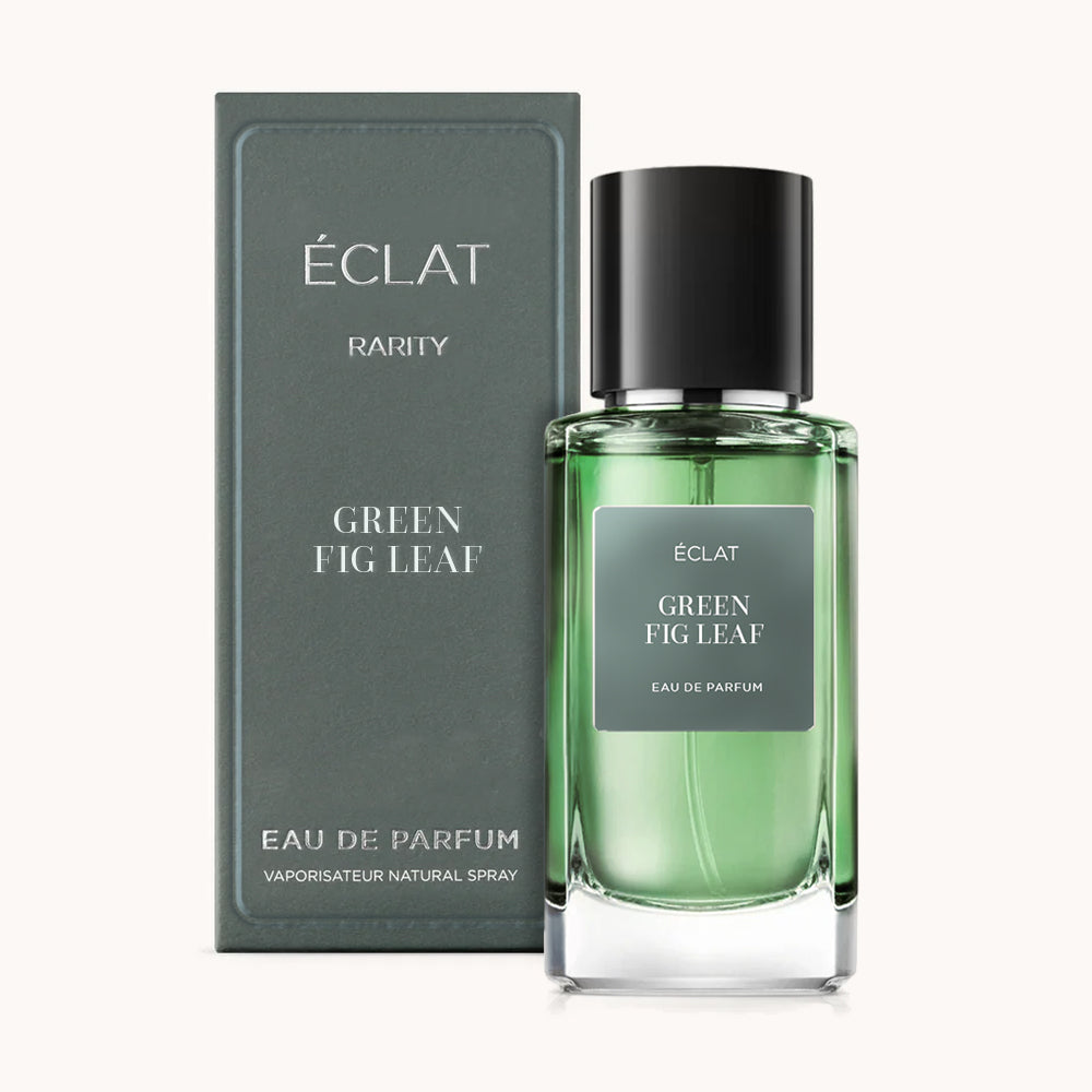 ÉCLAT Green Fig Leaf in a translucent green glass bottle with a black cap, alongside a matching green box with silver text.