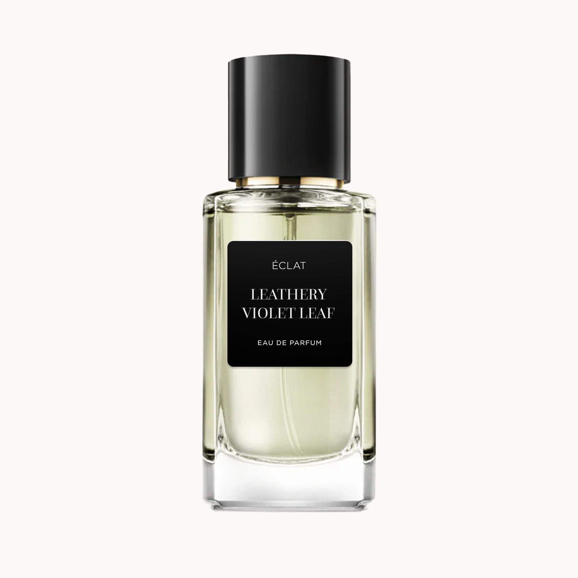 Faceted glass bottle of ÉCLAT Leathery Violet Leaf with a black matte label and a sleek black cap.