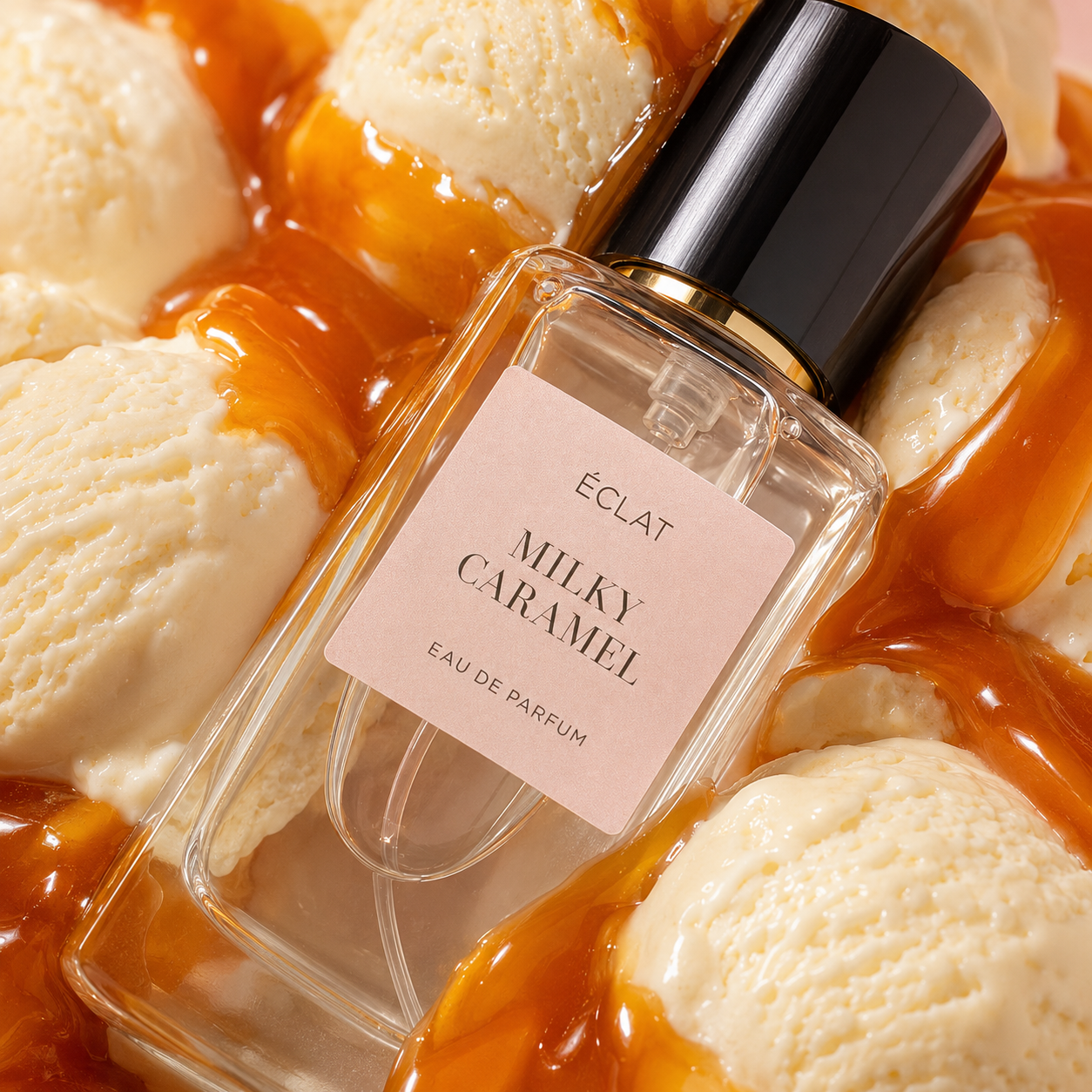 A faceted glass bottle of ÉCLAT Milky Caramel with a black cap, resting on creamy scoops drizzled with caramel.