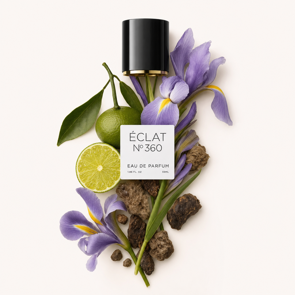 Un arrangement de fleurs d'iris, mandarine et notes terreuses entoure un bouchon noir avec une étiquette ÉCLAT.