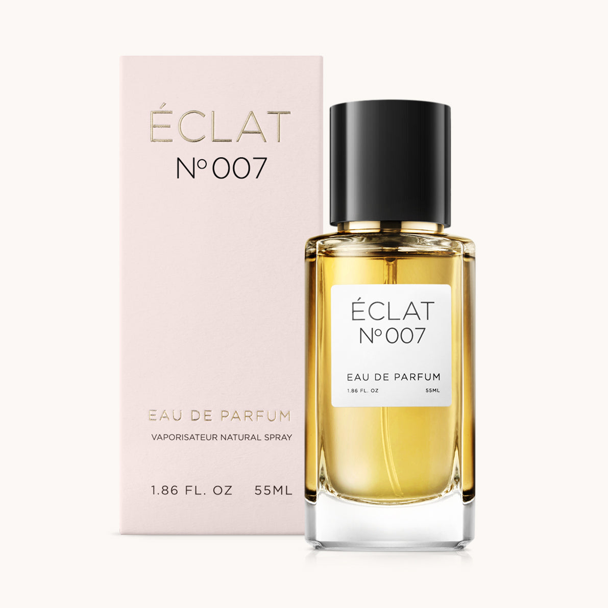 Parfum ÉCLAT Oriental Cloves avec flacon en verre transparent et bouchon noir, à côté d'une boîte rose avec des lettres dorées.