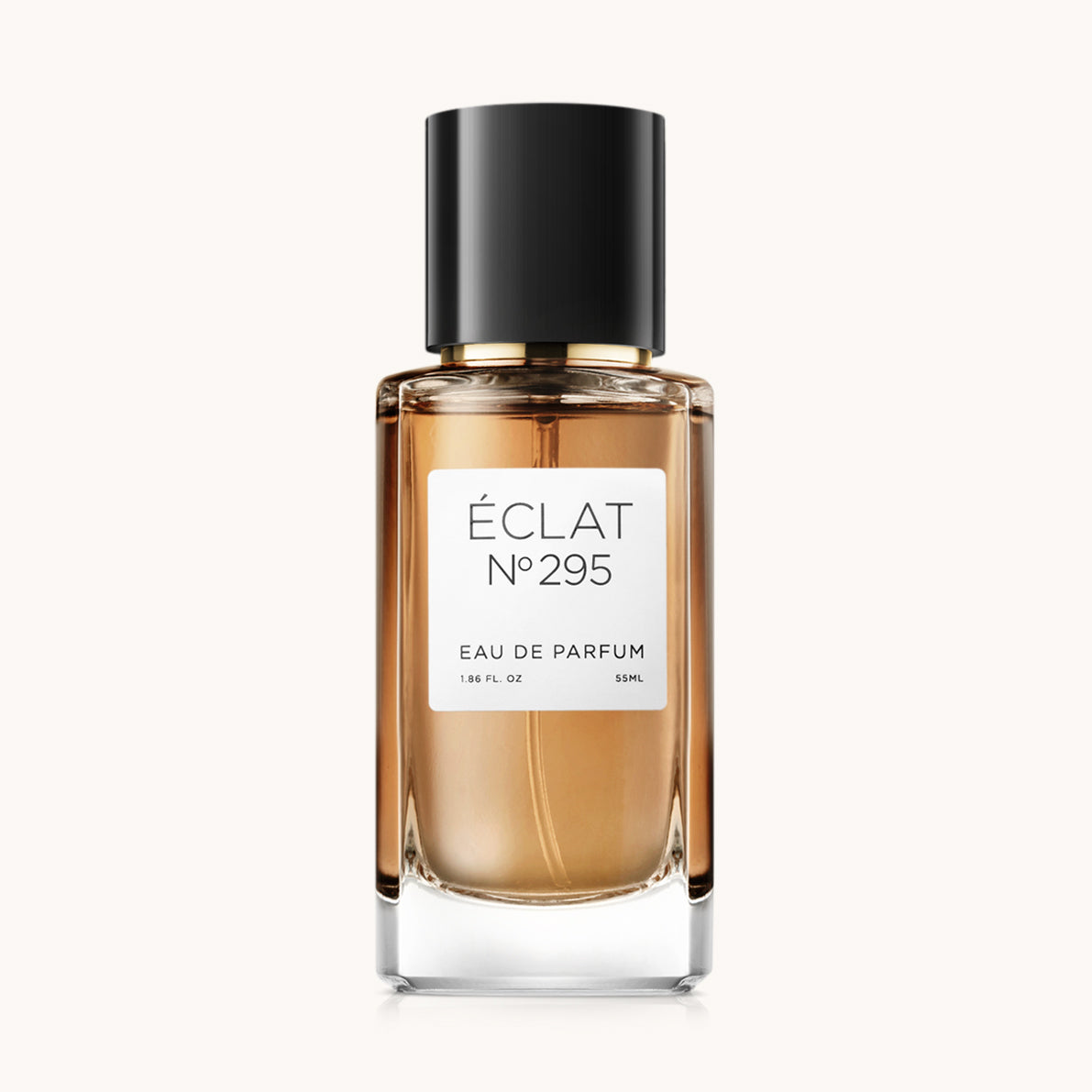 The ÉCLAT Powdery Vanilla perfume in a clear glass bottle with a black cap and white label.