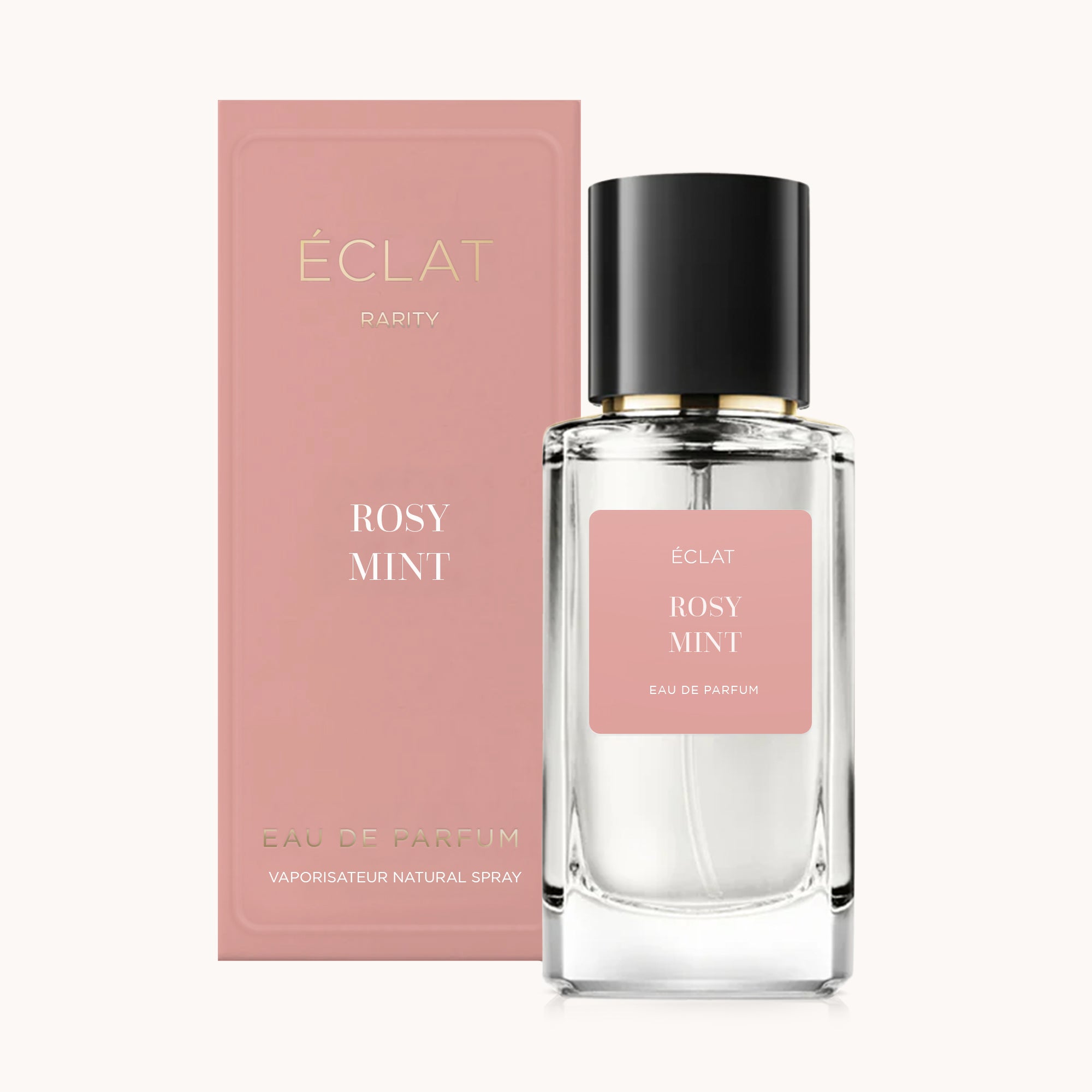 Clear glass bottle with a black cap and a pink label, beside a matching pink box for ÉCLAT Rosy Mint.